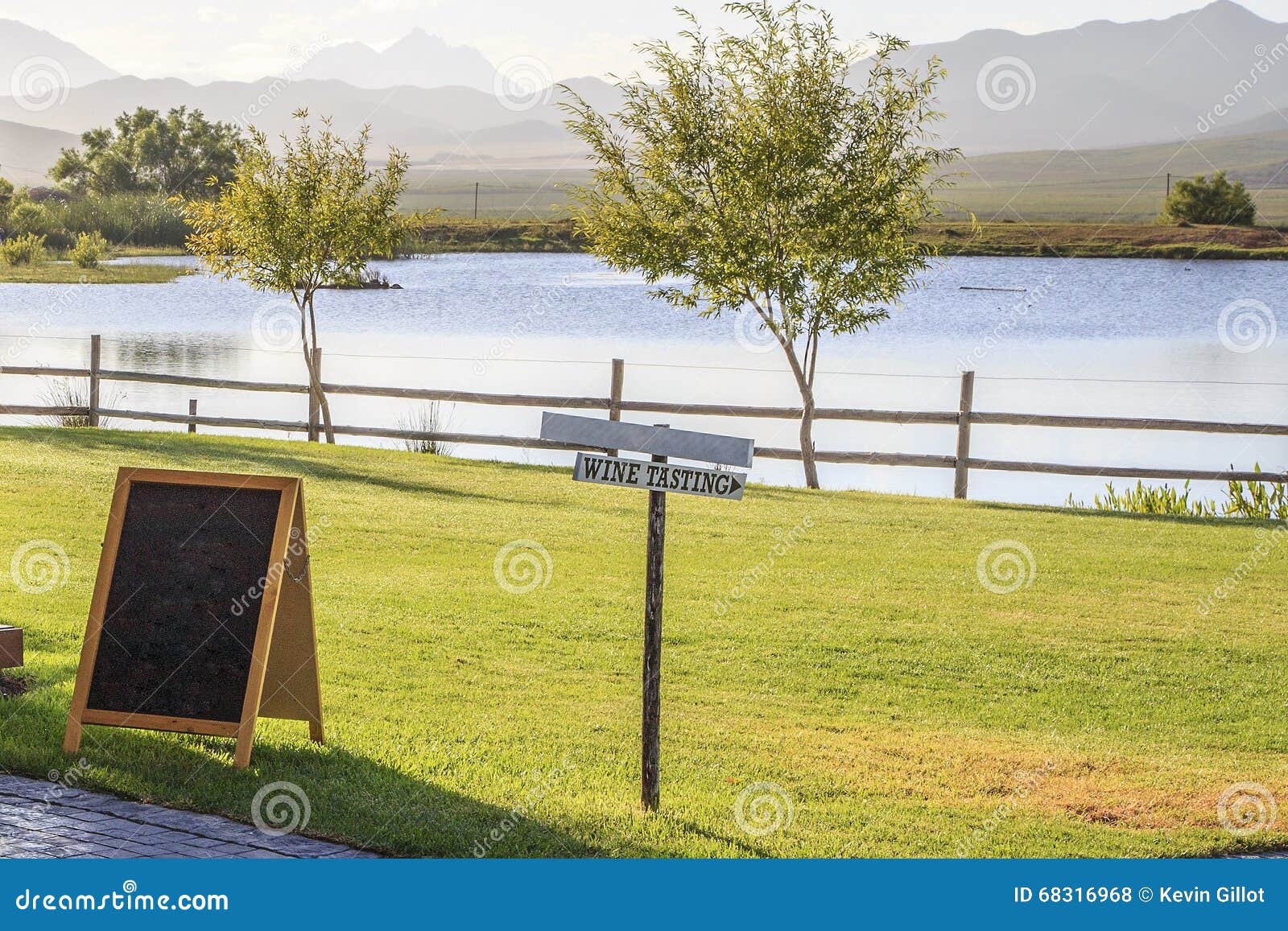 Wine tasting sign on the lake in the early morning. The Winelands - Robertson