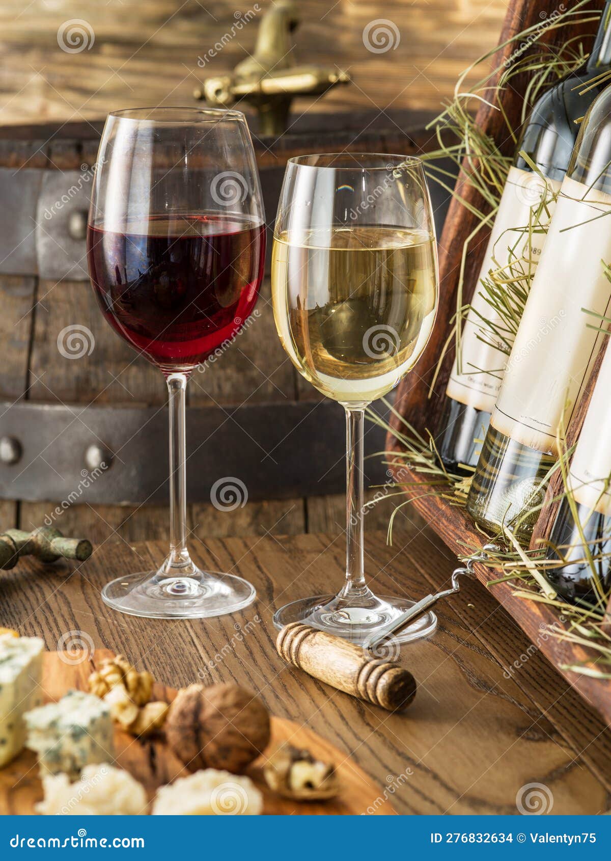 Wine Testing at the Storage. Glass of Wine and Wine Bottle in the Wine Cellar Stock Photo
