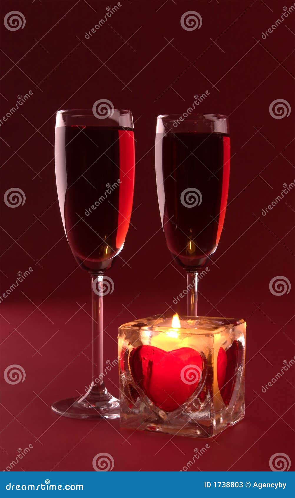 Wineglasses and Candle on the White Background Stock Image - Image of