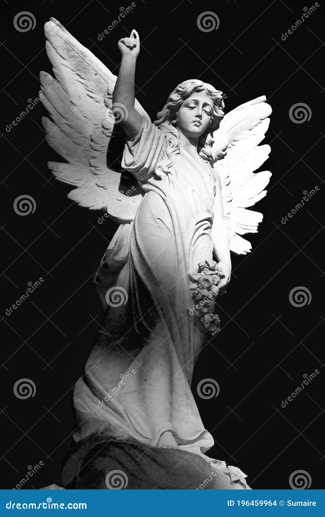Winged Angel Grave Statue Raised Right Hand Holding Flowers in Left Hand  Black and White Stock Photo - Image of shadows, black: 196459964