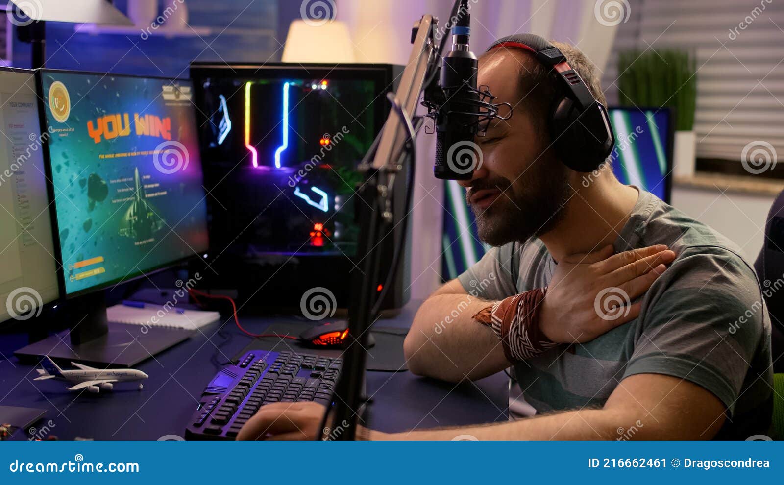 Winner Streamer Playing Online Space Shooter Game in Gaming Room Stock Image