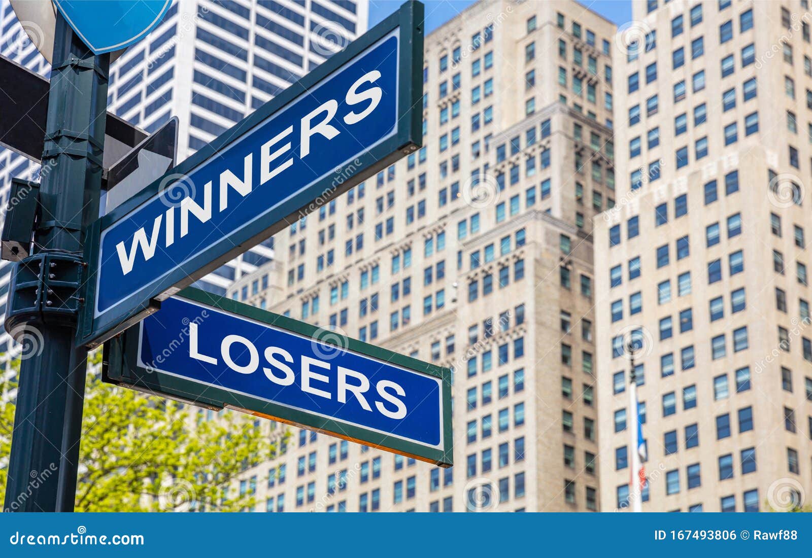 winners losers crossroads street sign. highrise buildings background