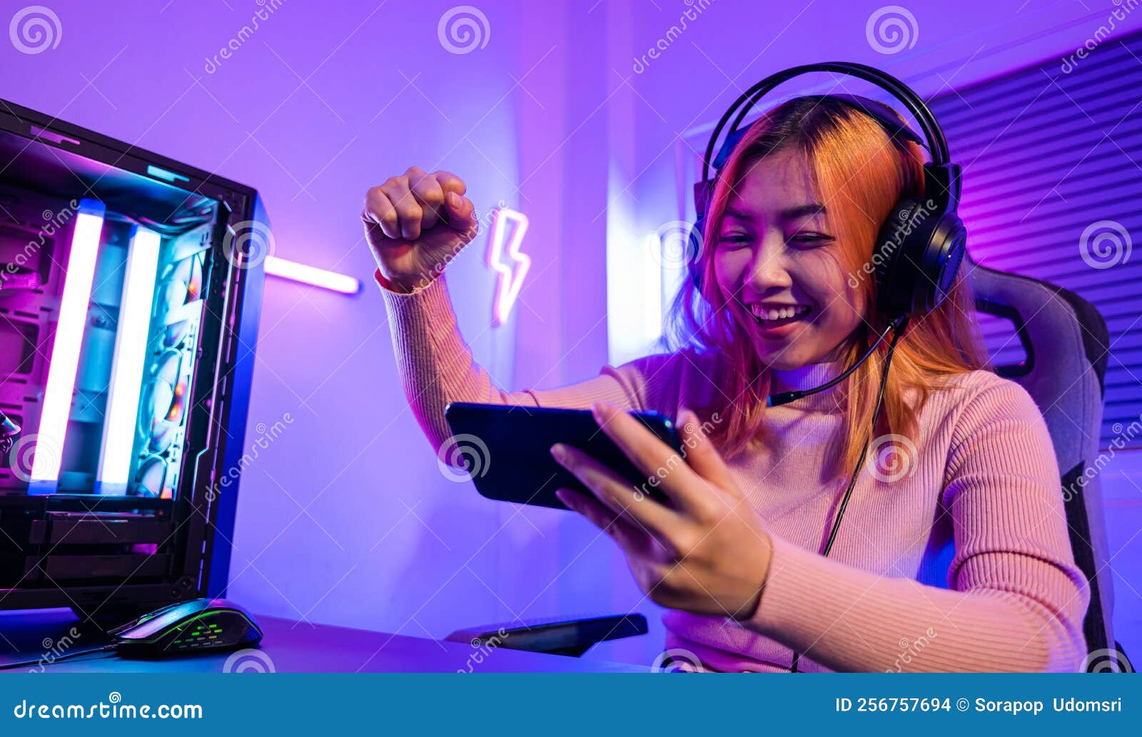 Free Photo  Player winning video games with controller and headset in  front of monitor. man using joystick and headphones, playing online games  on computer. person celebrating game win for leisure.