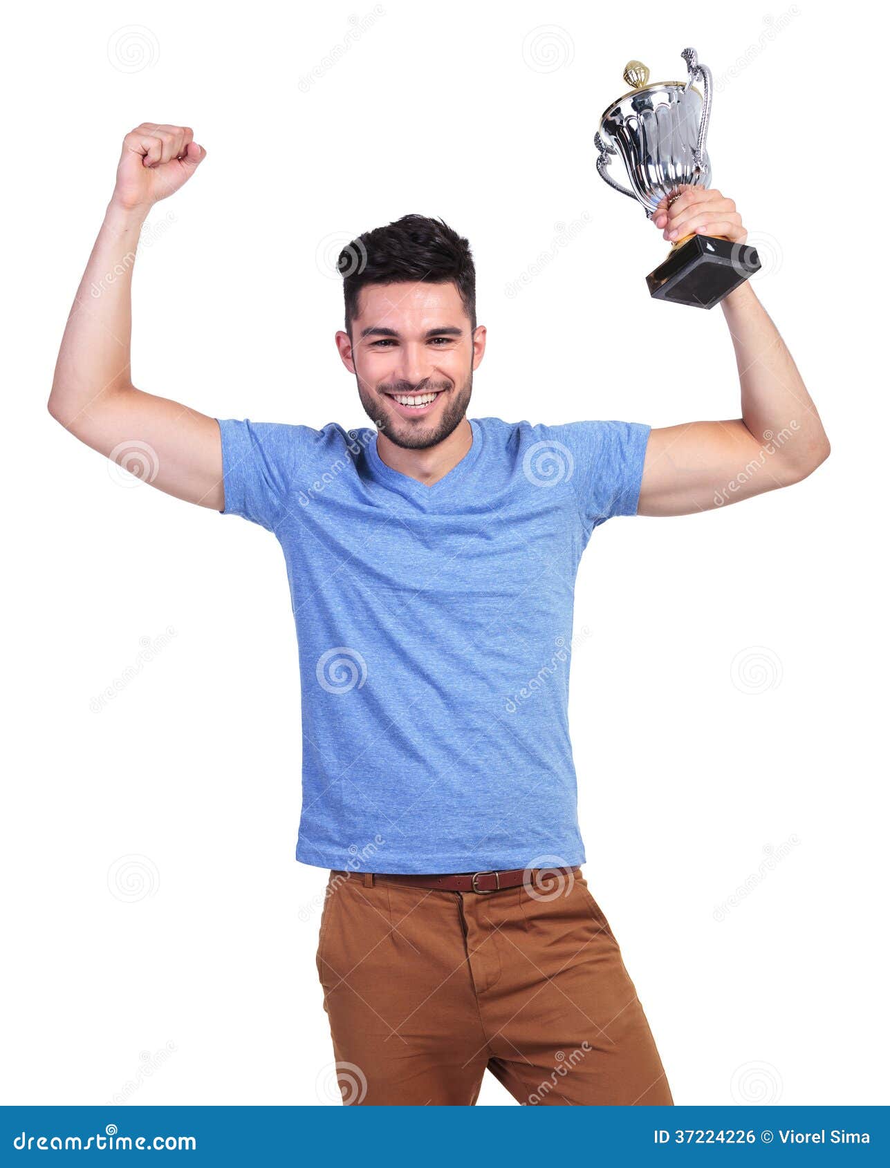 Winning Young Casual Man With A Big Trophy Cup Royalty Free Stock Image