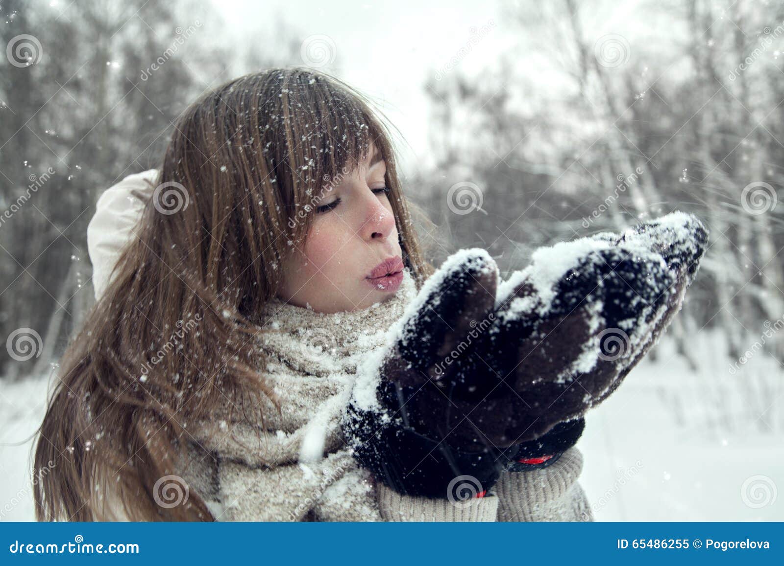 Winter Blondy Woman Blowing Snow on Herself. Attractive Winter Woman ...