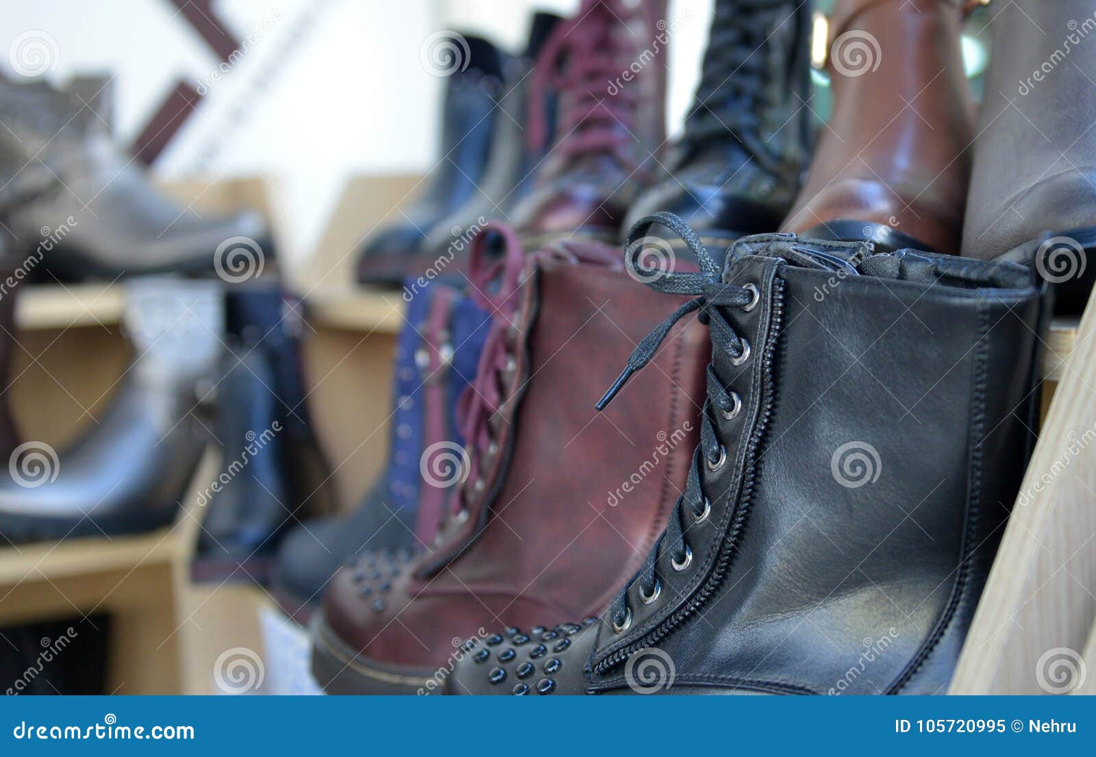 Winter Boots Display for Sale in Clothing Store Stock Image - Image of ...