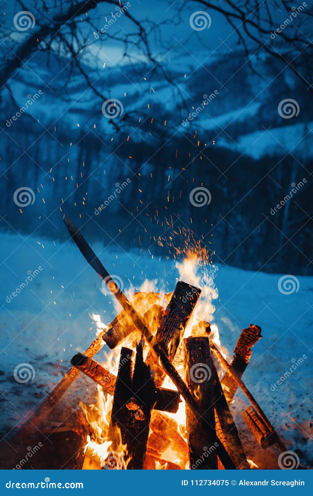Winter Campfire in the Top of the Mountains at the Evening. Stock Image