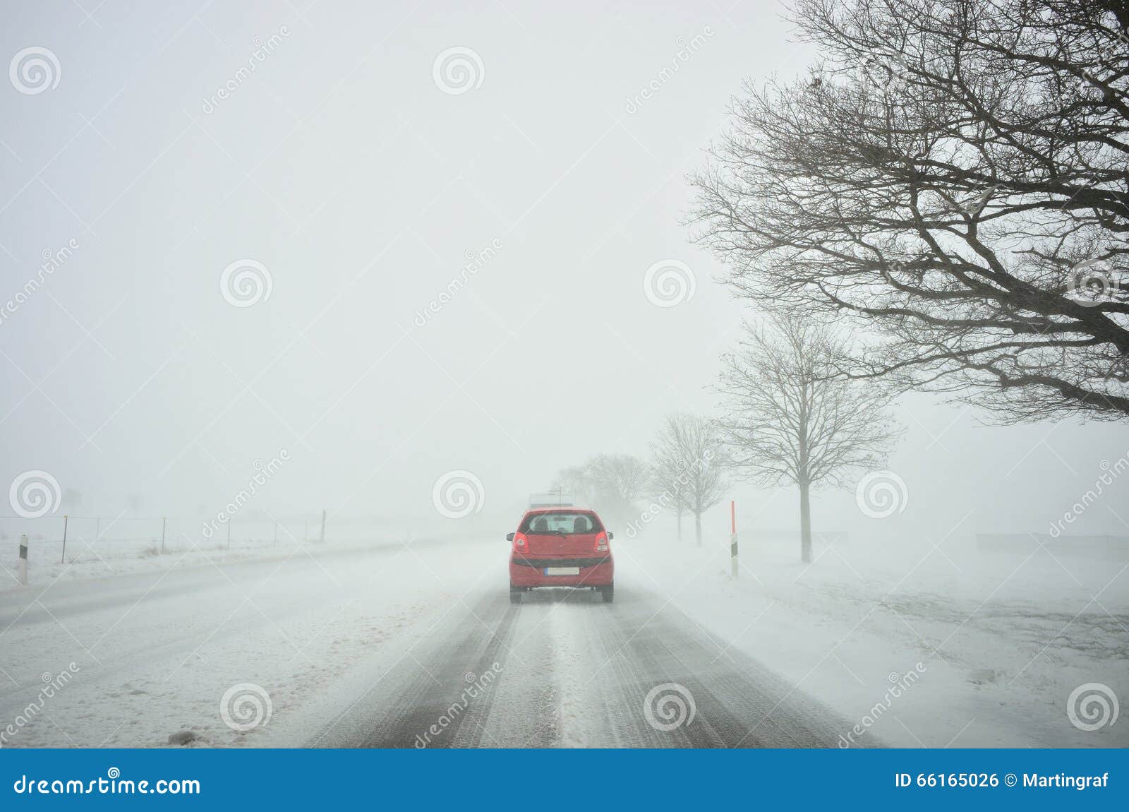 winter driving by snowstorm poor visibility