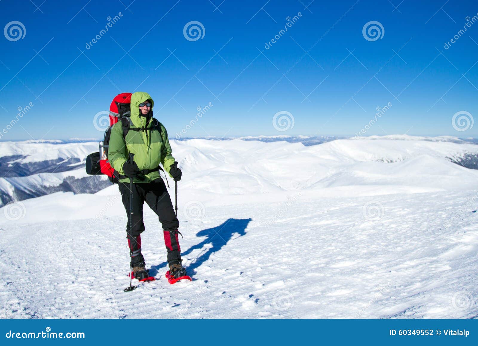 Winter Hiking in the Mountains on Snowshoes with a Backpack and Tent. Stock Photo Image of