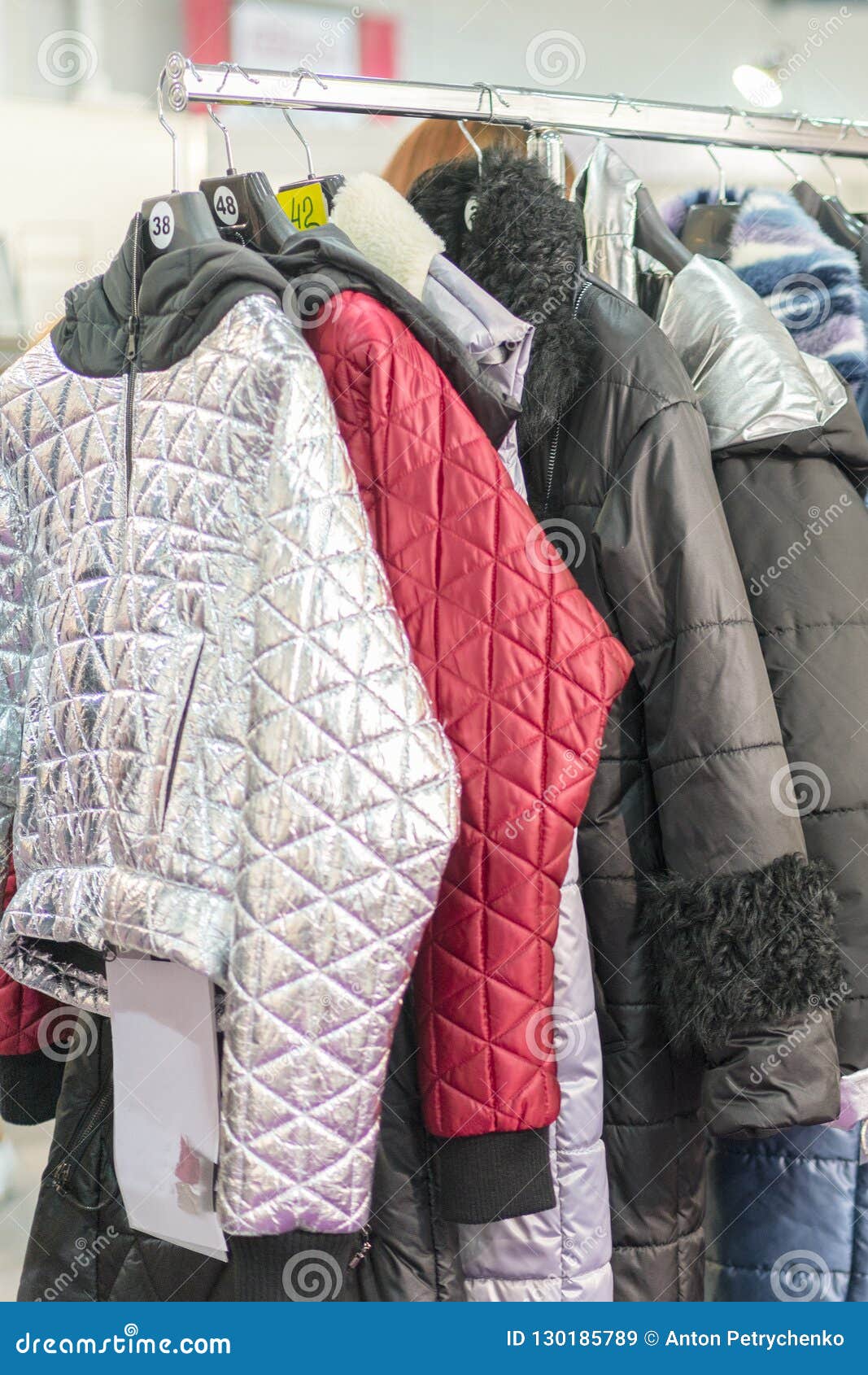 Winter Jacket in Winter Sale on a Clothes Rack. Women`s Coats on ...