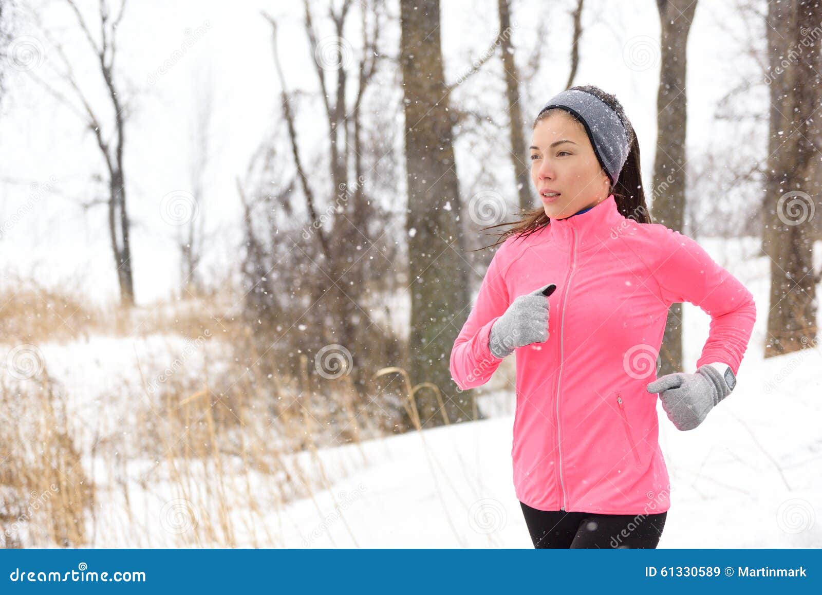 Winter Jogging - Woman Runner Running in Cold Air Stock Image