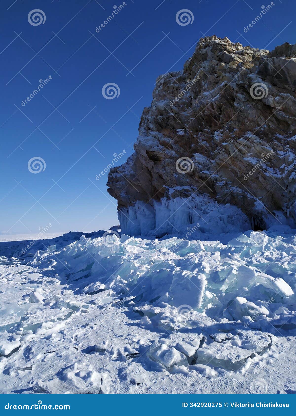 winter landscape on lake baikal with cliffs and ice