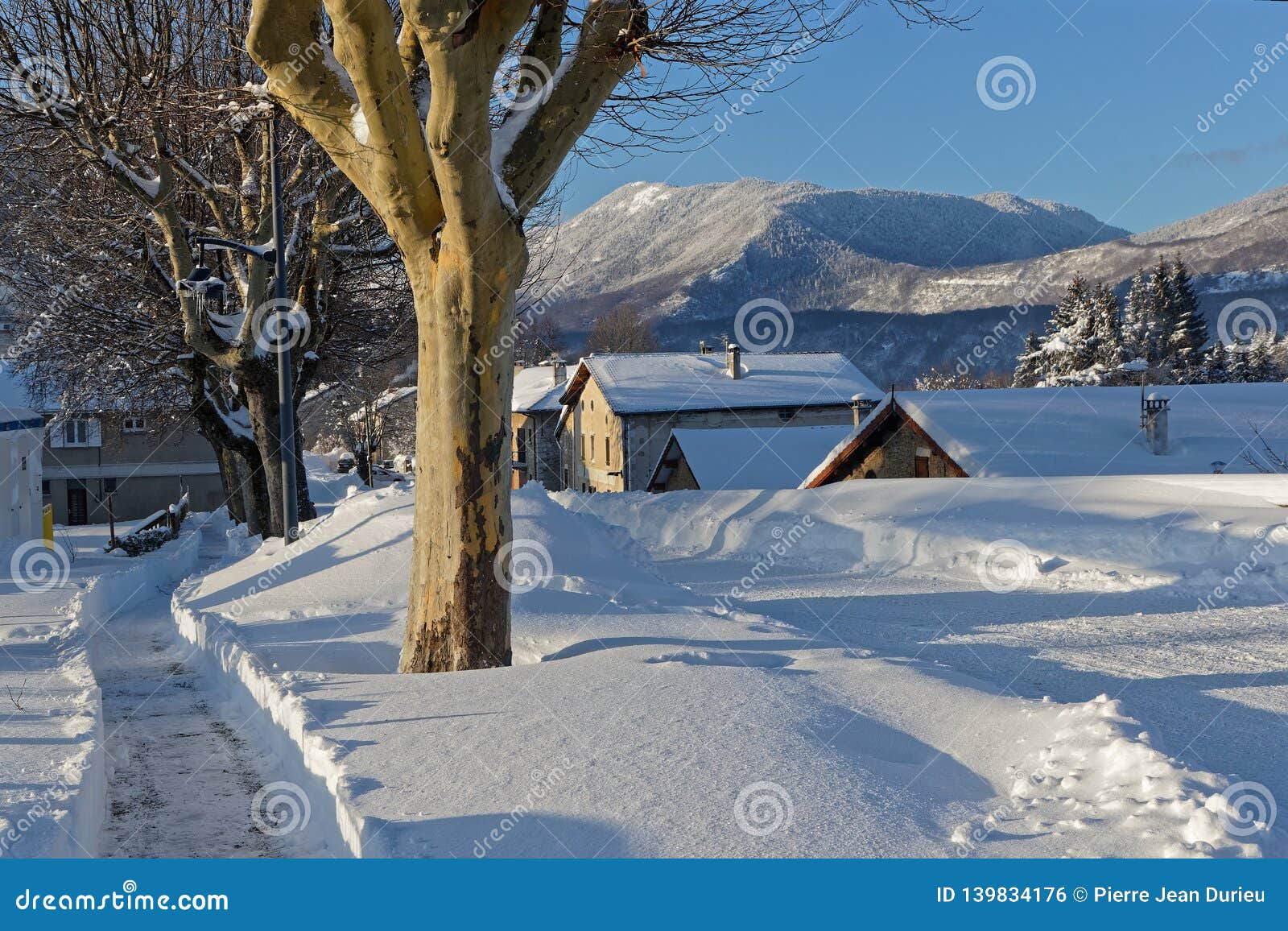 snow path in a village of vercors