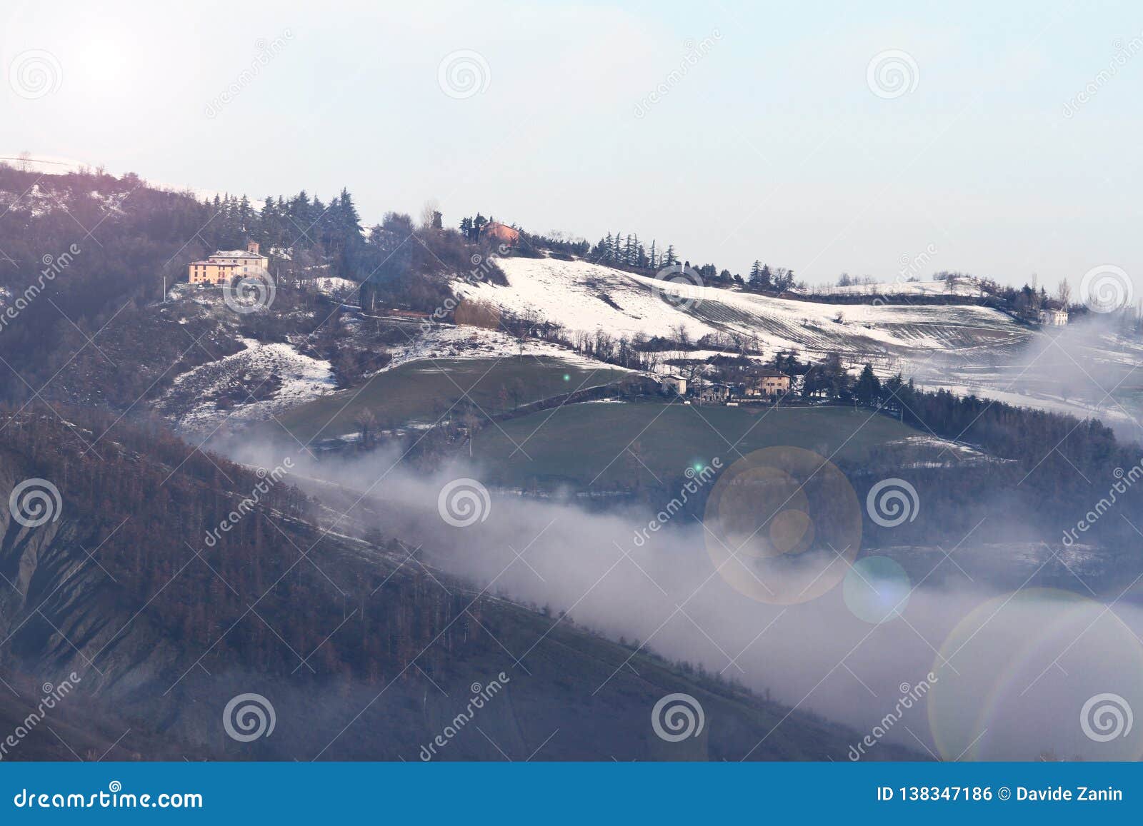 winter landscape with snow and fog in the tosco emiliano apennines, bologna, italy