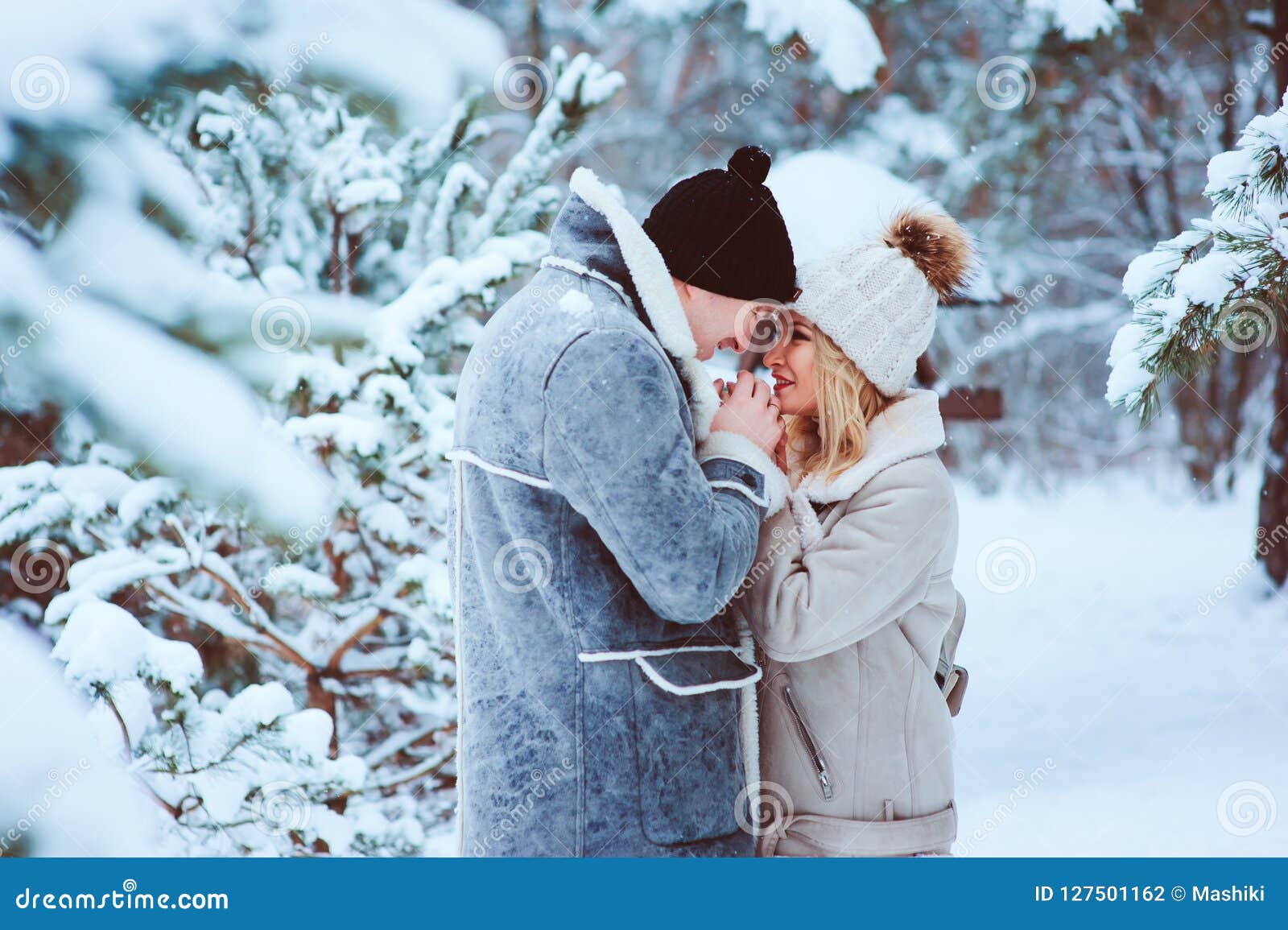 Winter Portrait Of Happy Romantic Couple Warm Up Each Other On The Walk