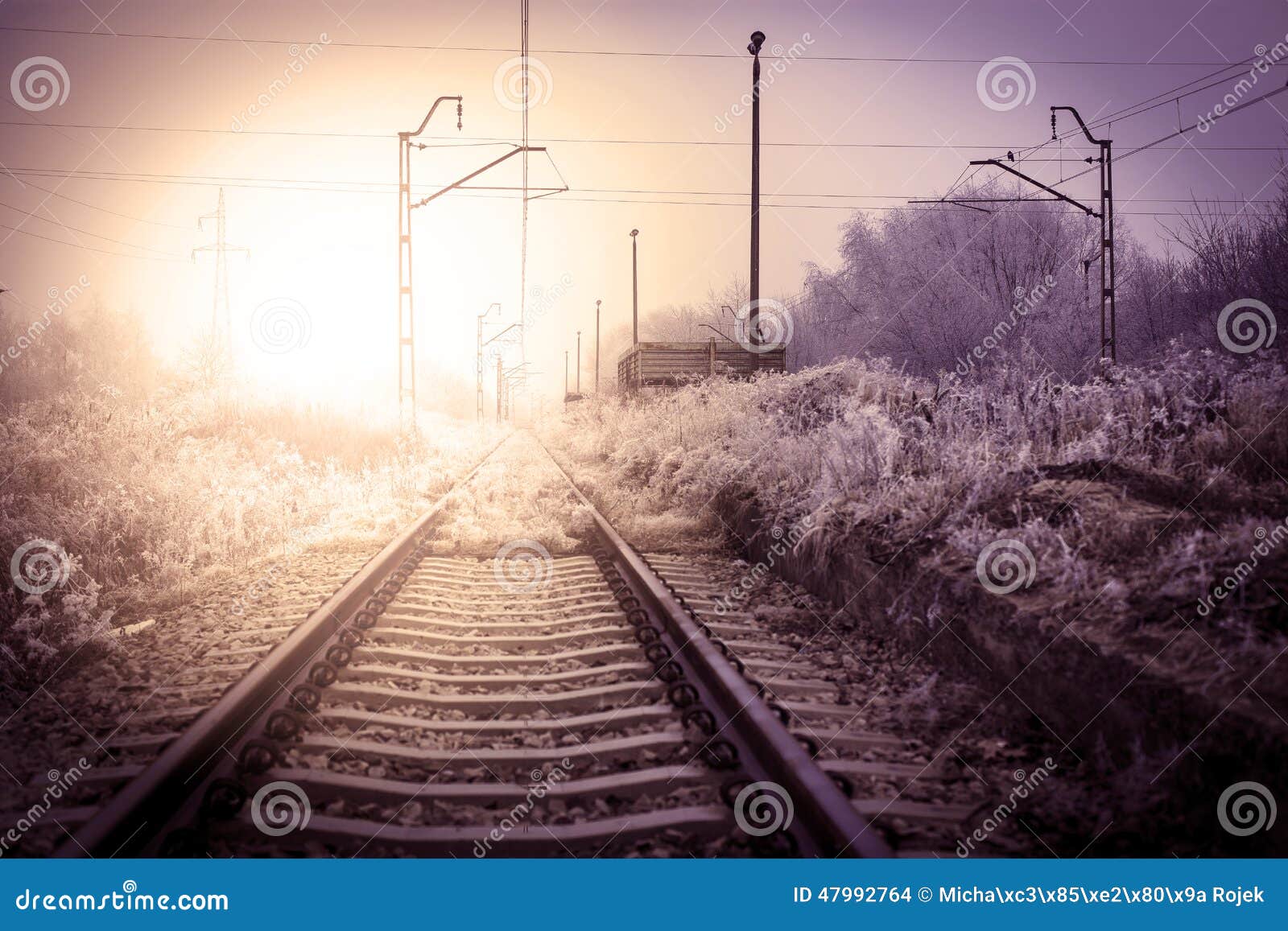 Winter railroad landscape with sunrise.