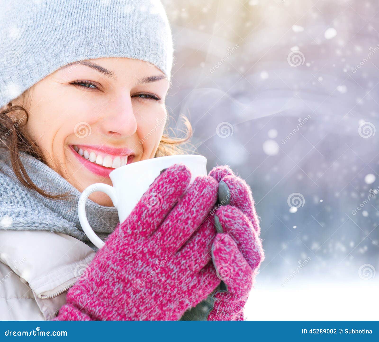 winter woman with hot drink outdoors