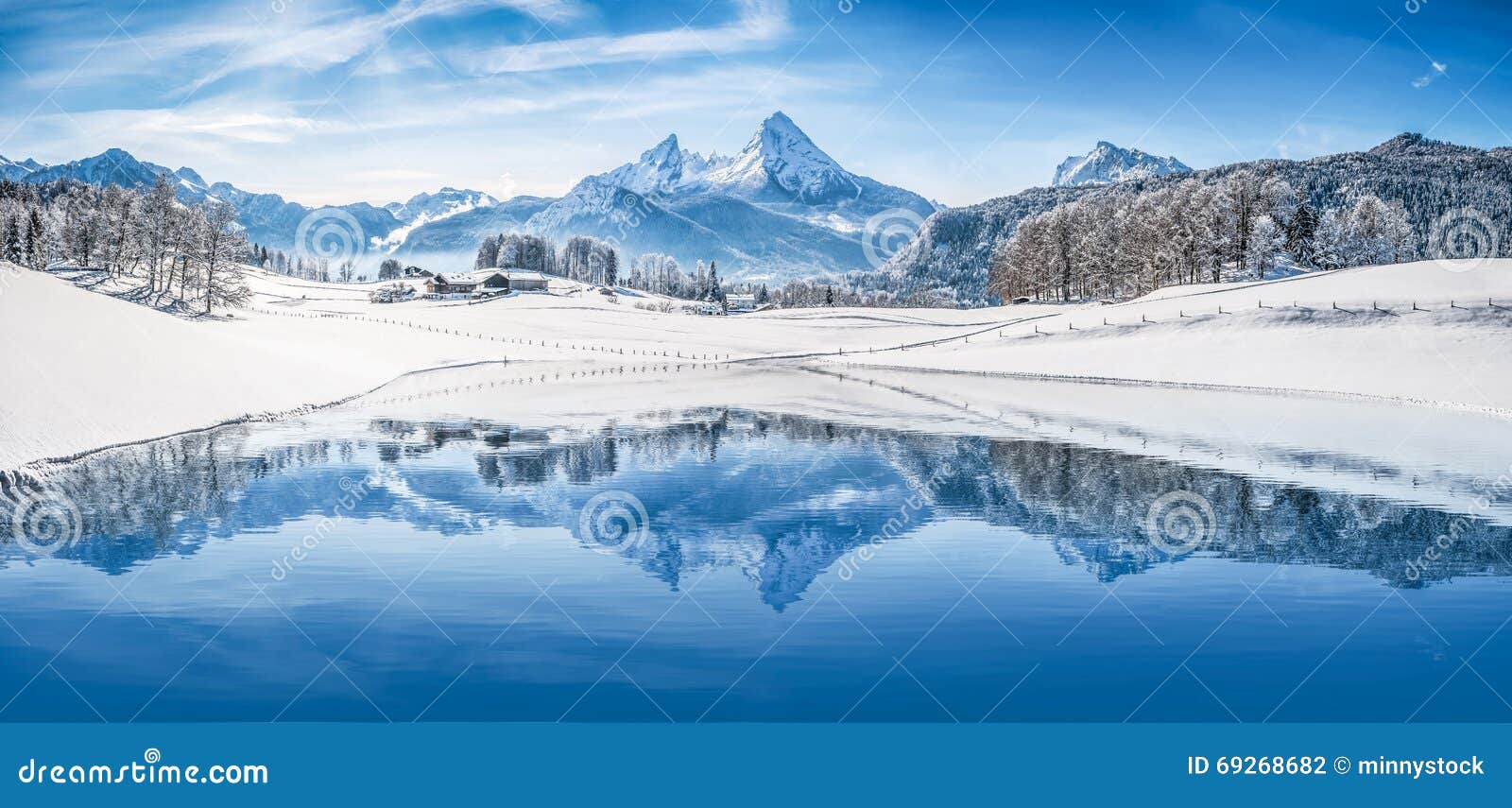 Winter Wonderland In The Alps Reflecting In Crystal Clear Mountain Lake