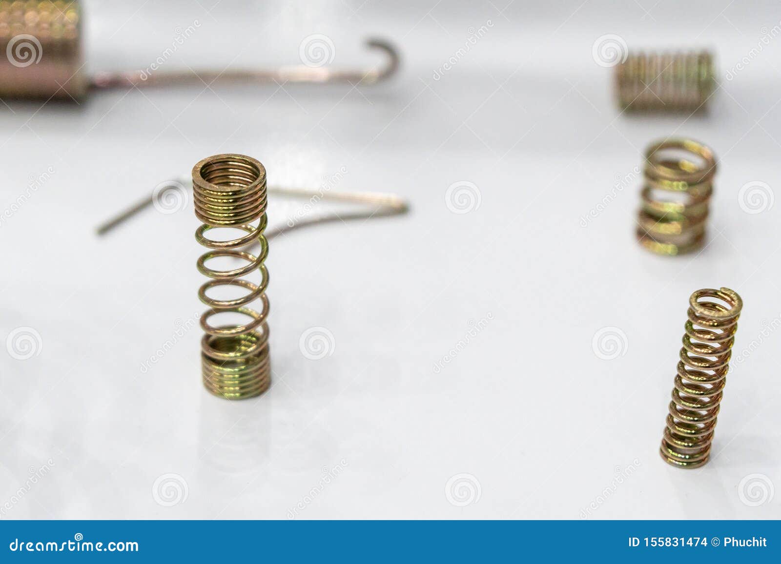 The Wire Coil Spring Spare Parts on the White Background. Stock Photo