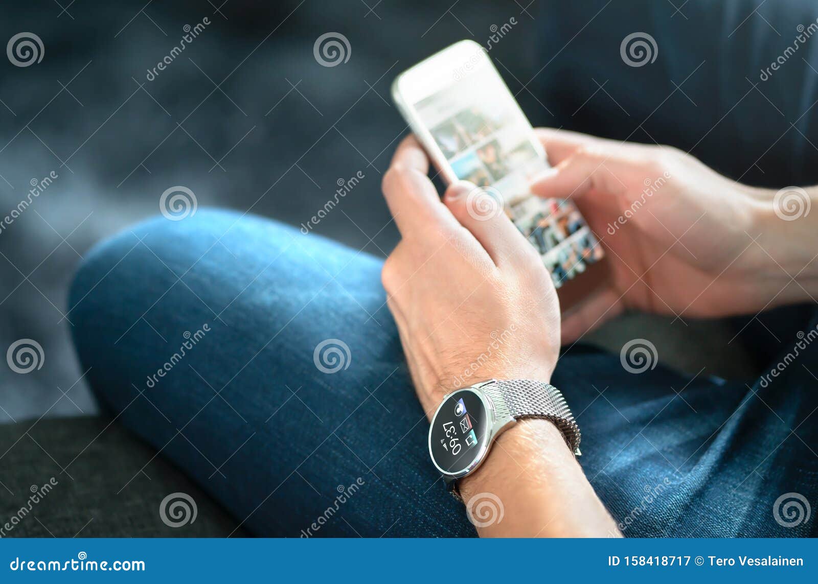 wireless connection between smart watch and mobile phone. man using wearable gadget and digital app.