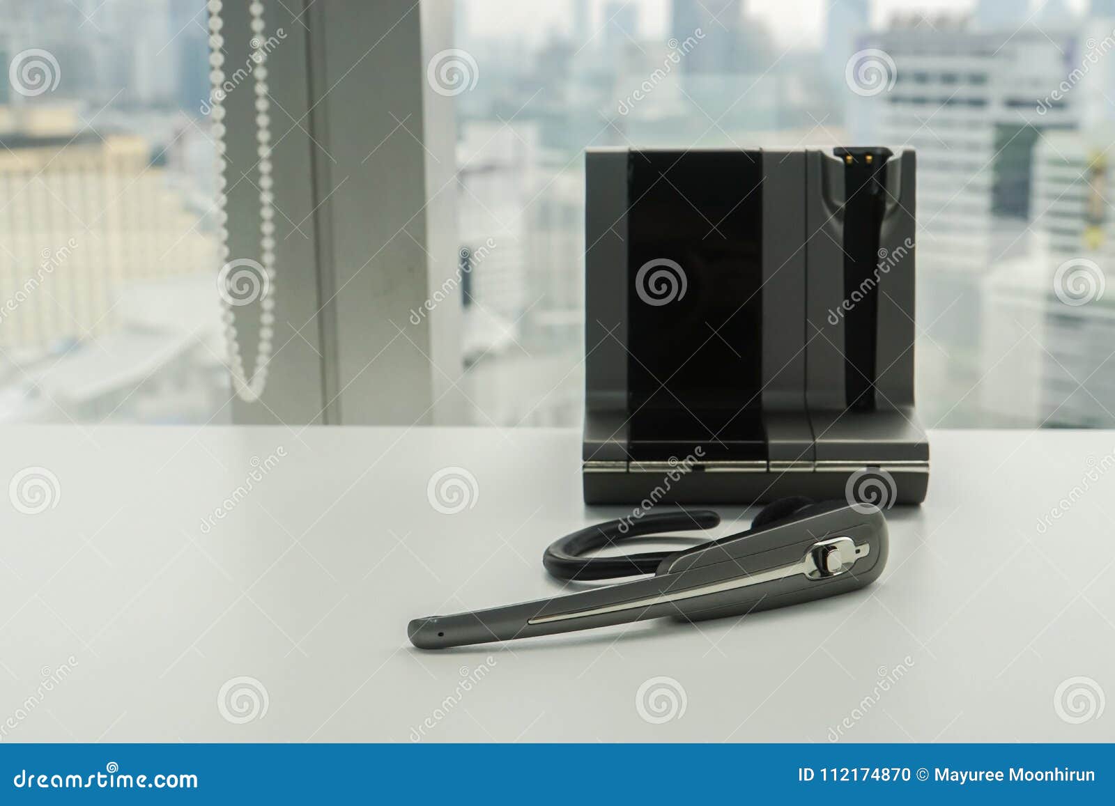 Wireless Headset On White Office Desk For Business Conference