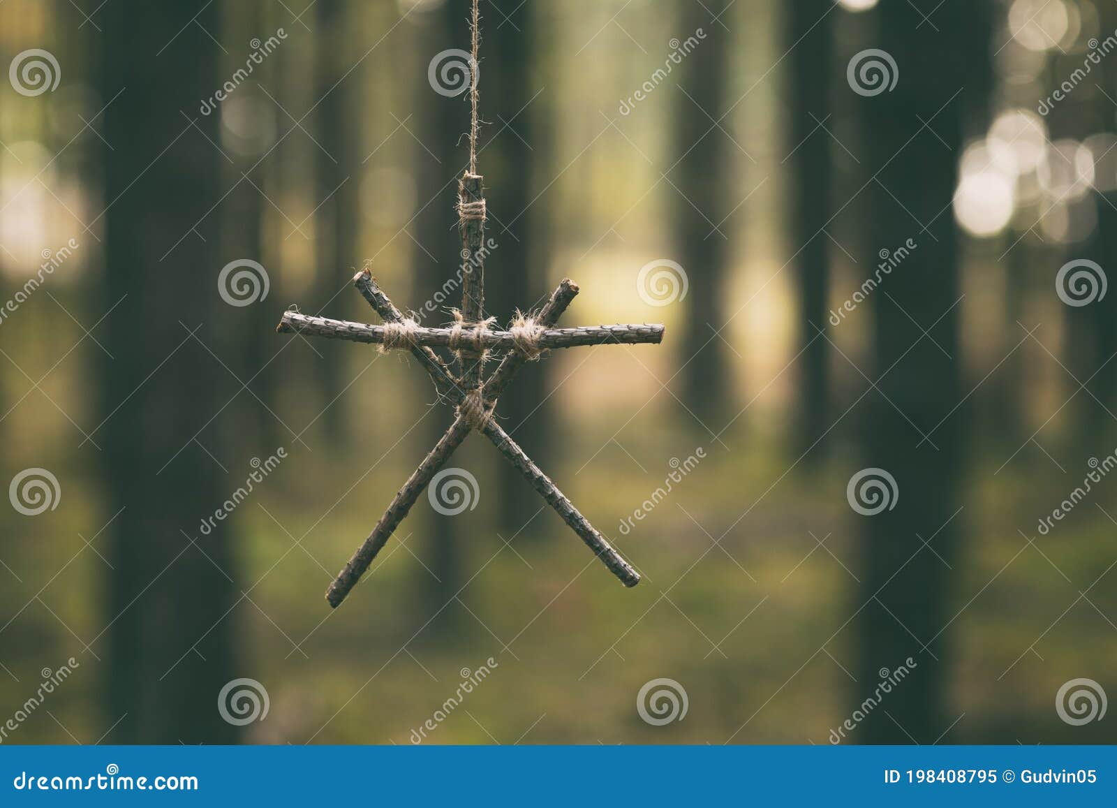 witchcraft sticks . magic occult . totem hanging on tree in dark forest.