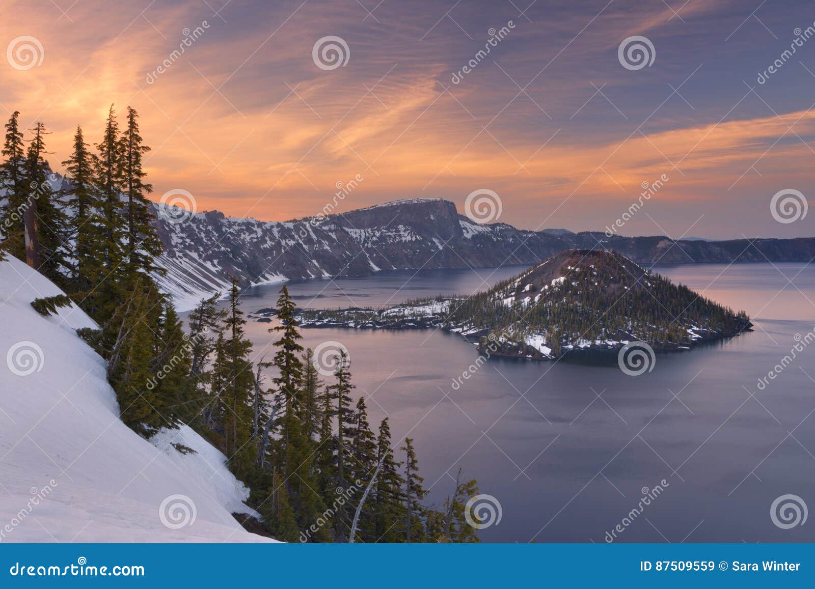 wizard island in crater lake in oregon, usa at sunset