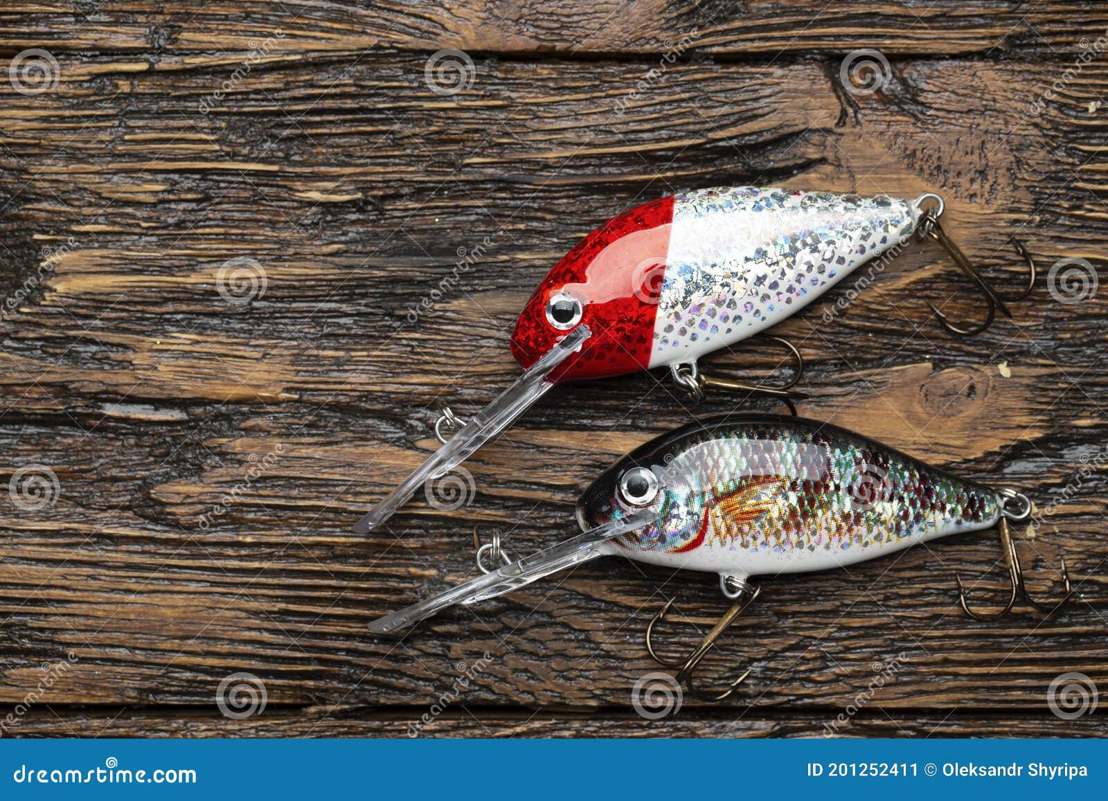https://thumbs.dreamstime.com/z/wobbler-perch-pike-bait-fishing-tackle-baubles-wood-background-201252411.jpg