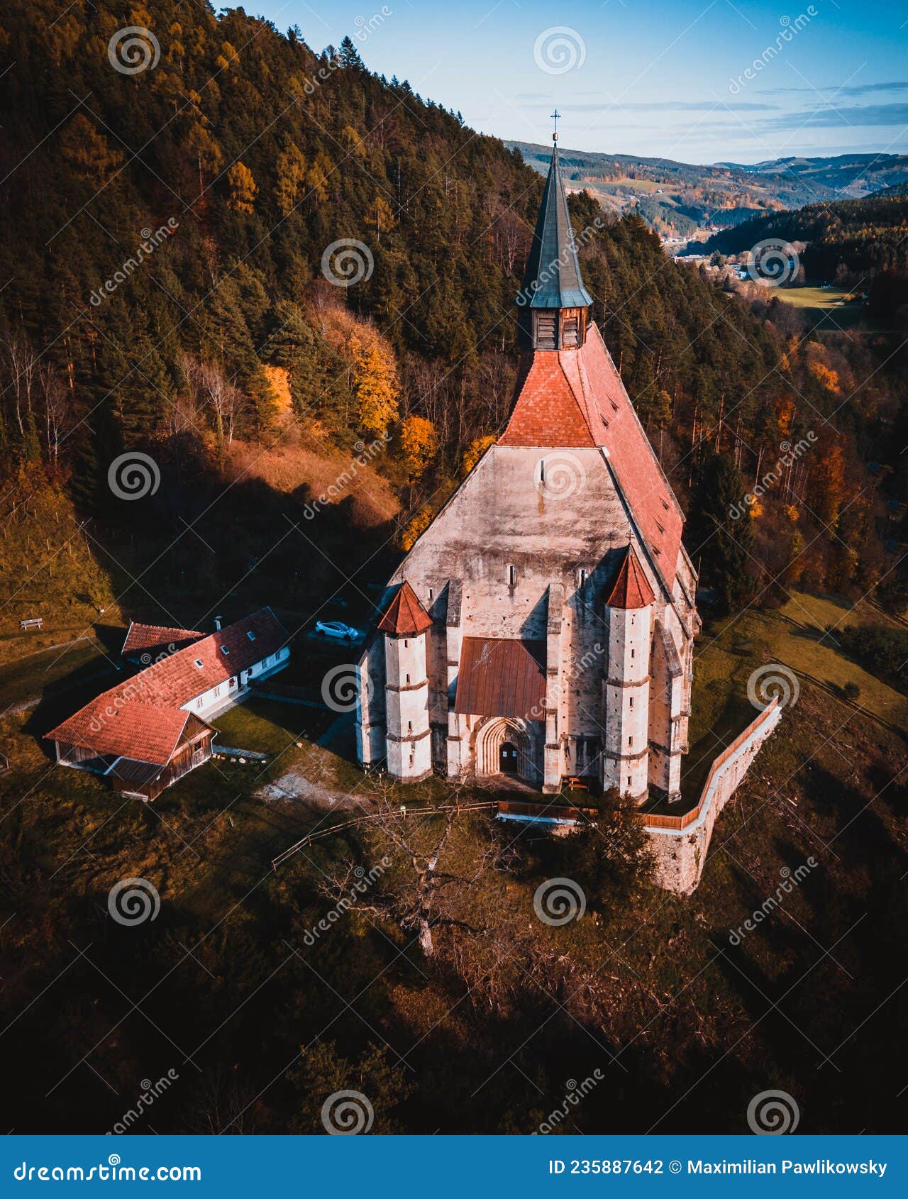 the wofgangskirche, a gothic catholic church in the austrian village kirchberg am wechsel aerial view