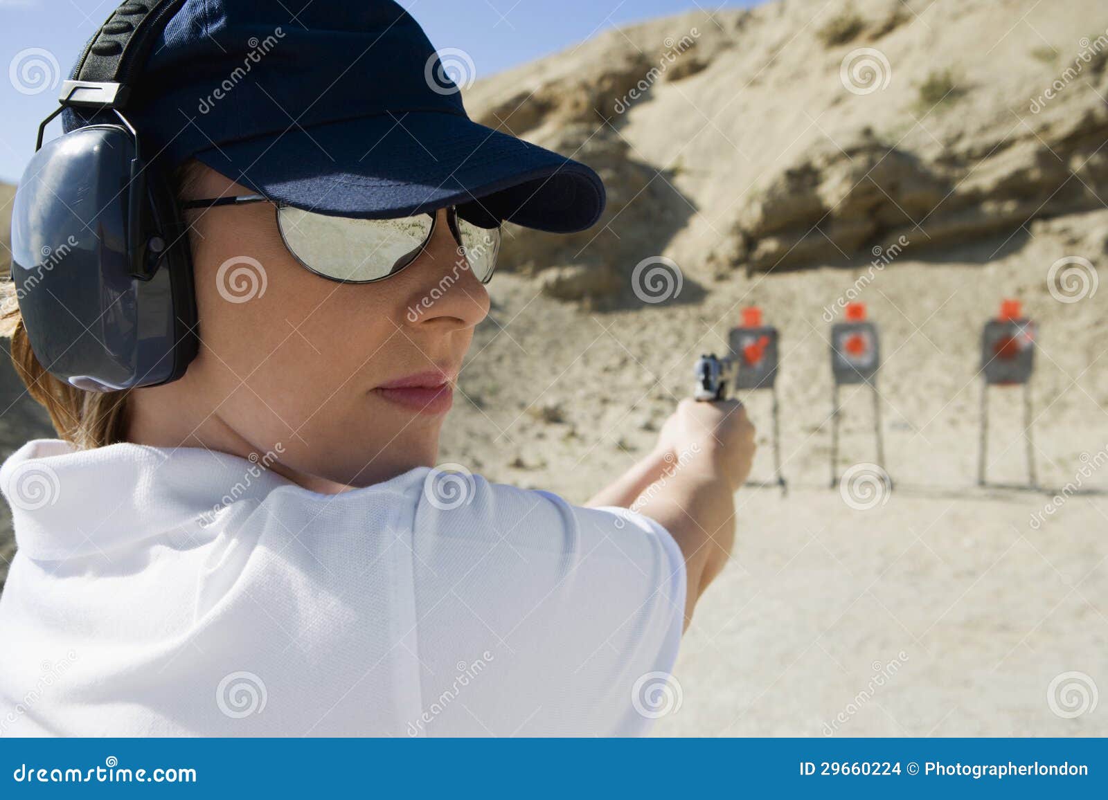 Woman Aiming Hand Gun at Firing Range Stock Photo Image of eyewear