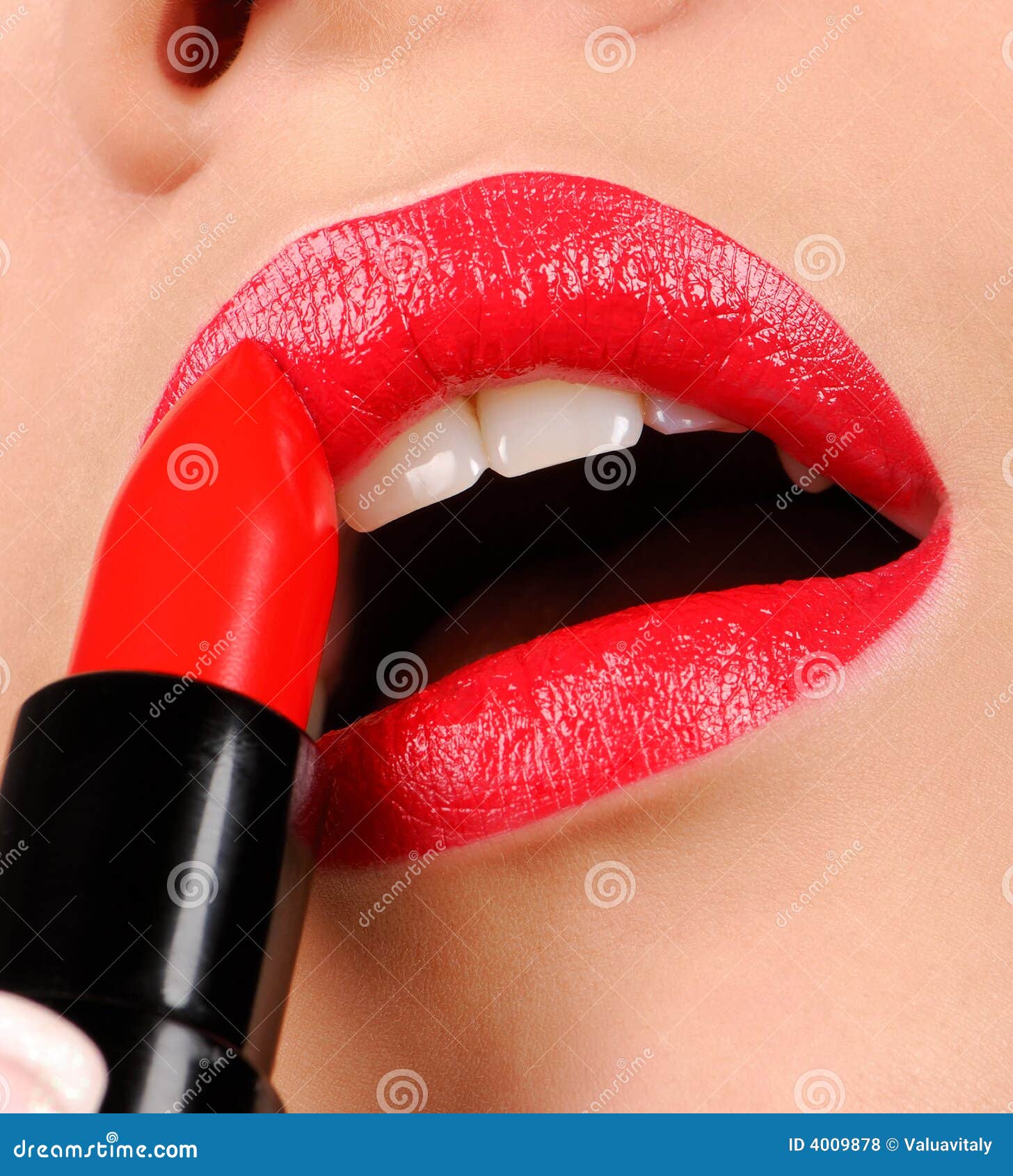 Woman Applying Gloss Lipstick. Stock Photo Image of lipstick, lips