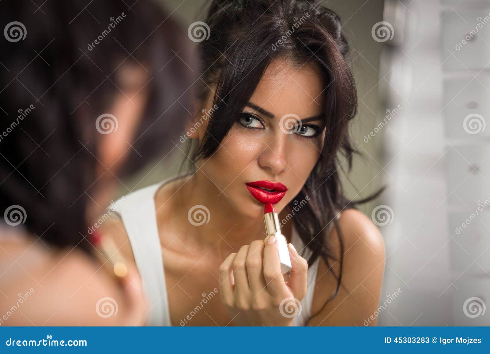 woman applying lipstick