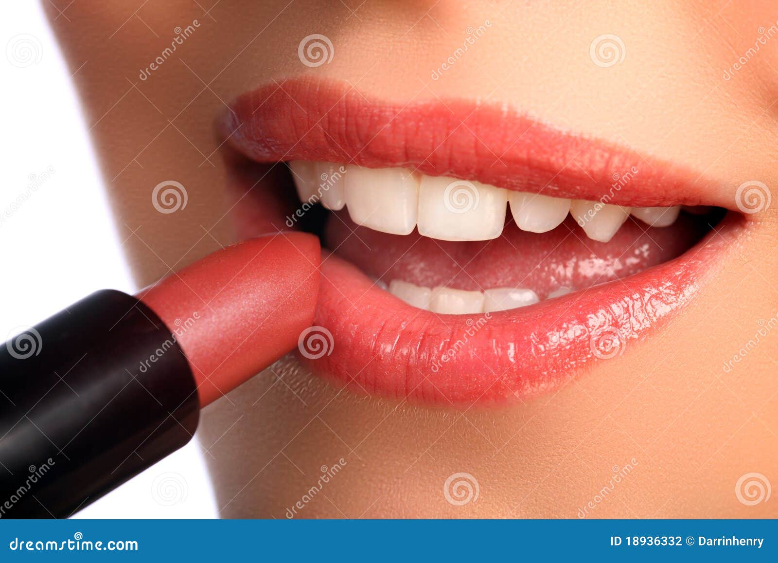 woman applying lipstick beauty cosmetics to lips