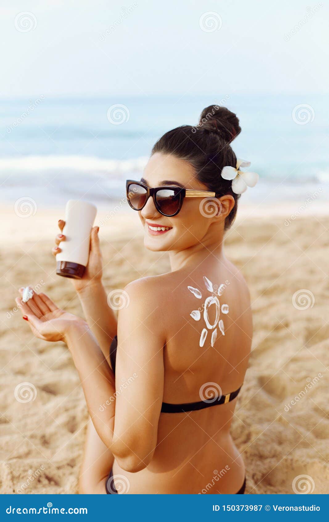 Woman Applying Sun Cream On Tanned Shoulder In Form Of The Sun Sun Protection Sun Cream Skin