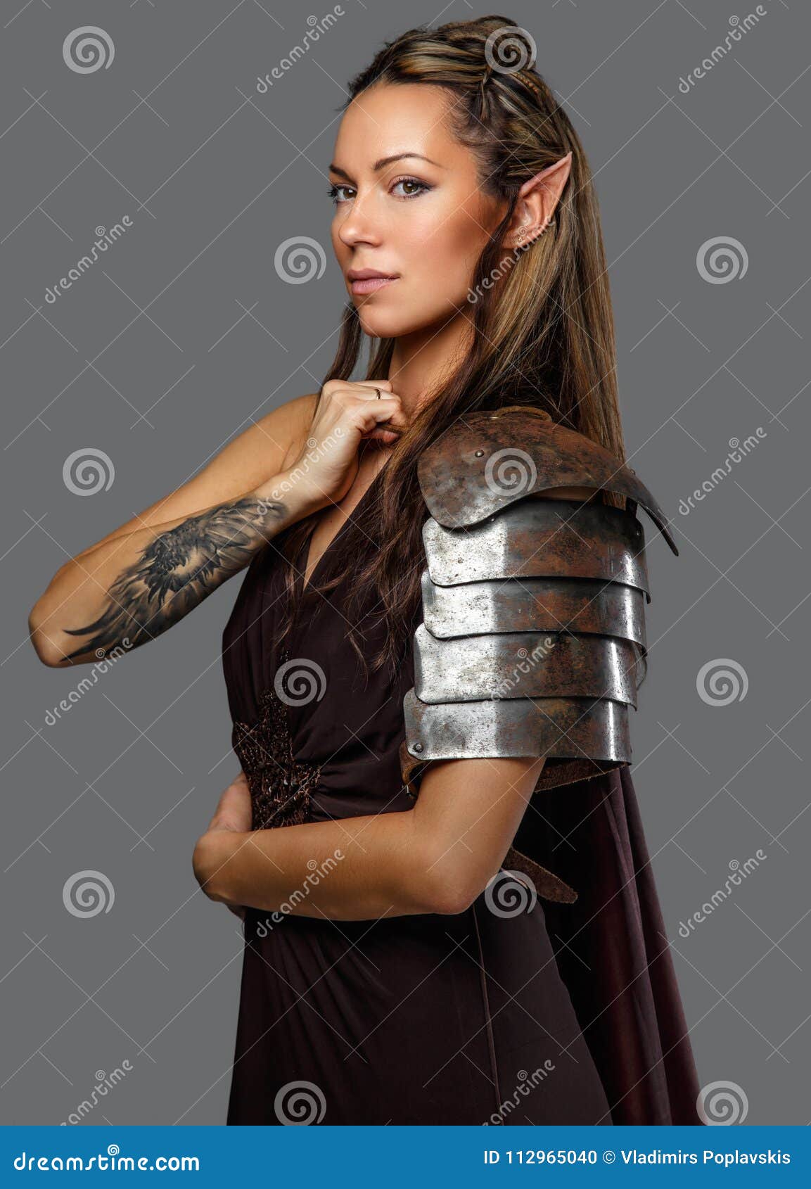 A Woman in Armour with Tattoo on Her Hand. Stock Photo - Image of human