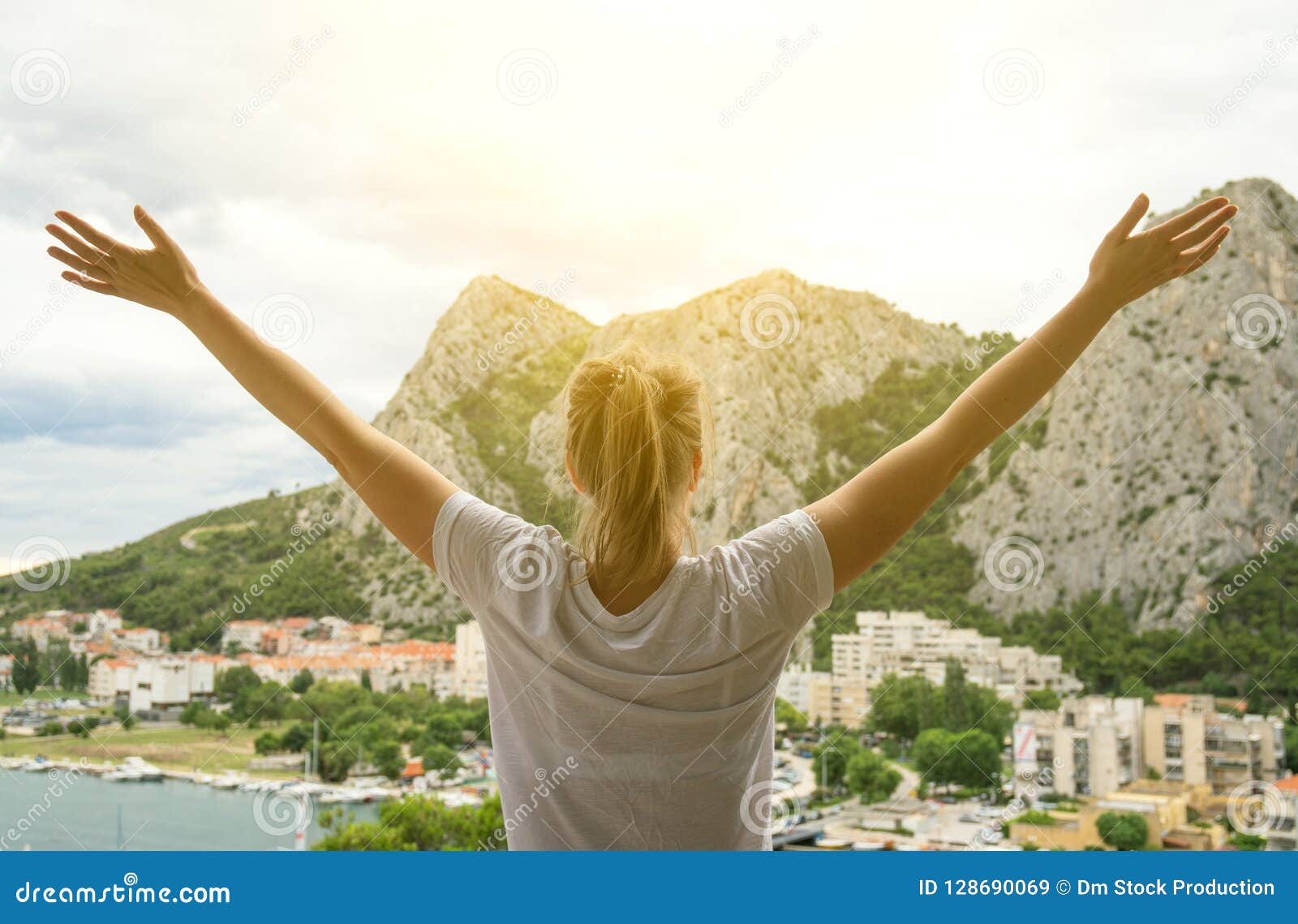 woman with arms wide open.