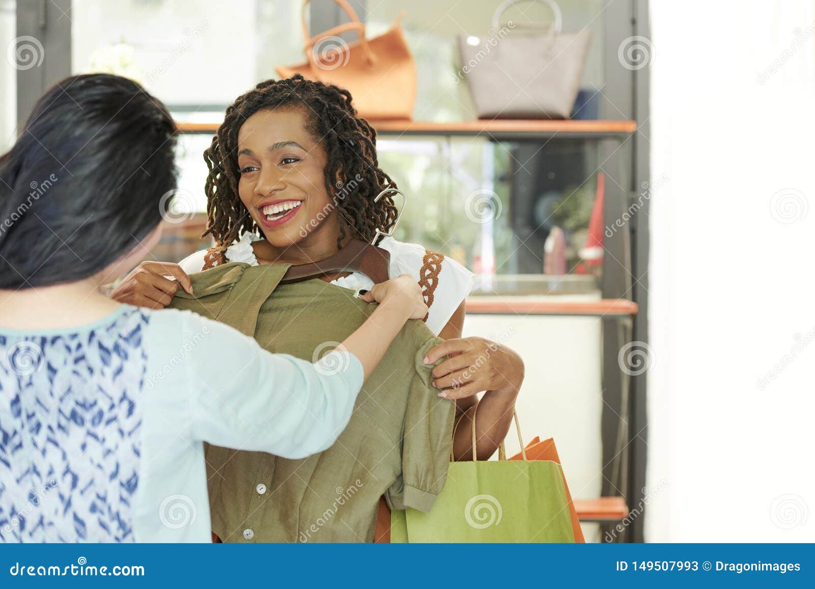 Friends Choosing Dress at Store Stock Image - Image of assistant ...