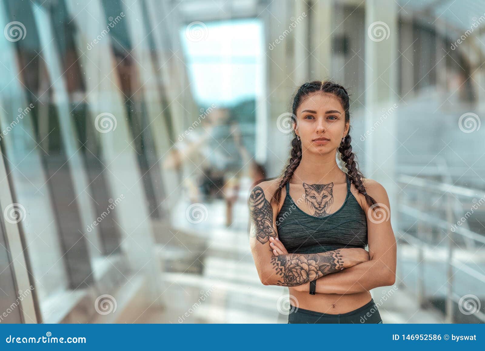 Premium Photo | Beautiful wet athlete girl with tattooed hand in sportswear  resting after running