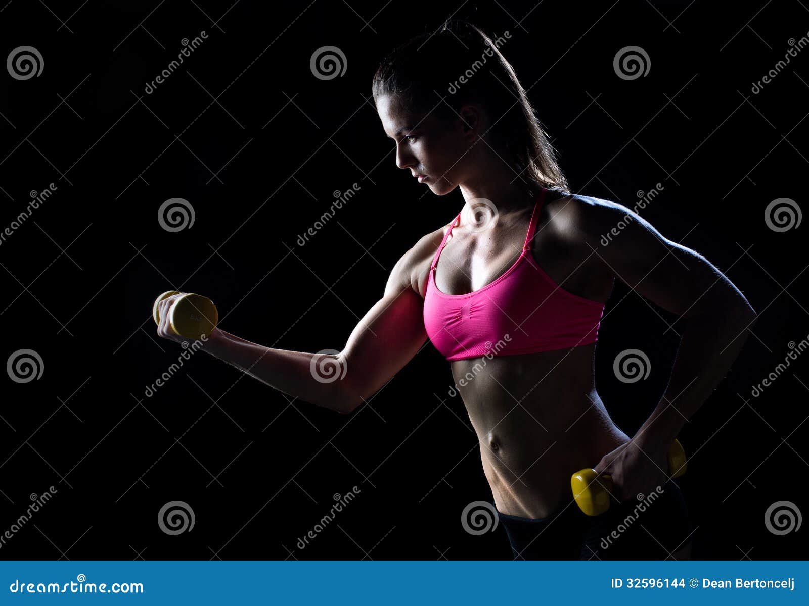 Woman Athlete With Weights RoyaltyFree Stock Image