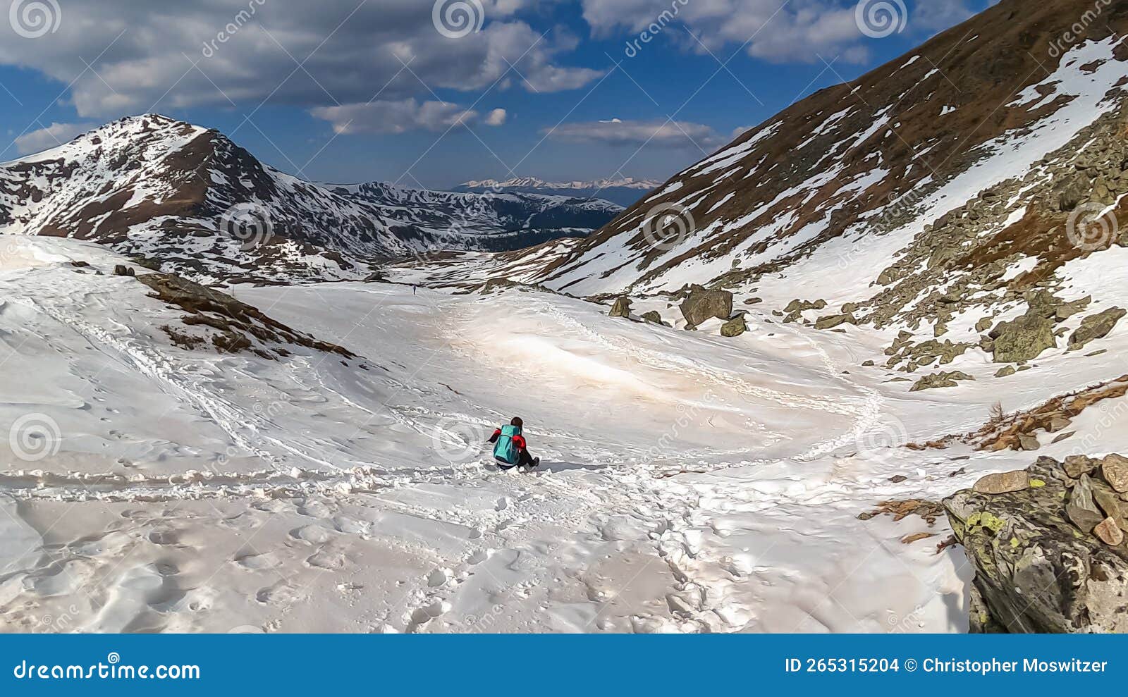 Woman with Backpack Sliding Down on Snow Covered Hiking Trail with  Panoramic View on Snowcapped Mountain Peak Kreiskogel Stock Photo - Image  of recreation, backpacker: 265315204