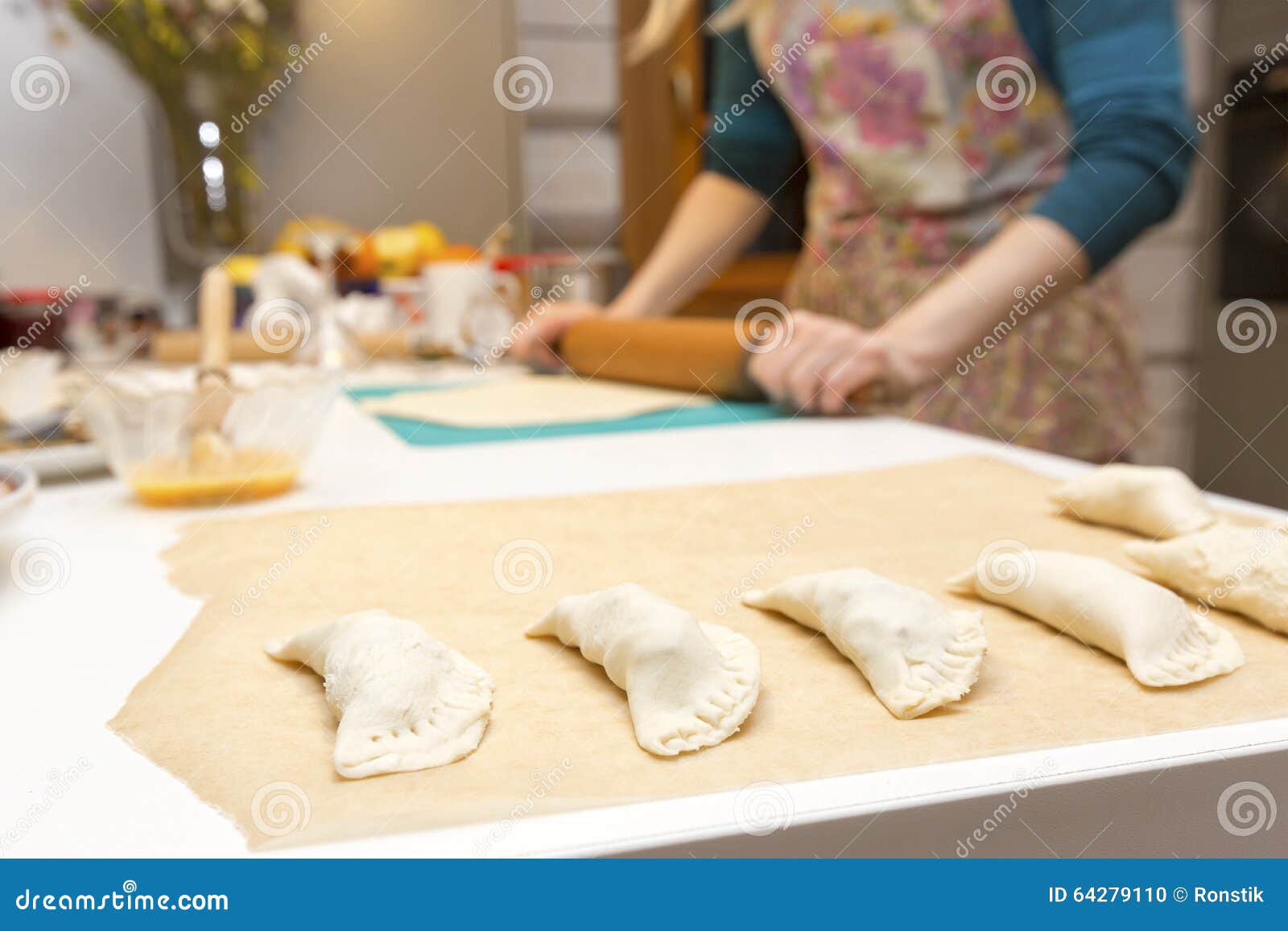 woman baking pies in her home kitchen
