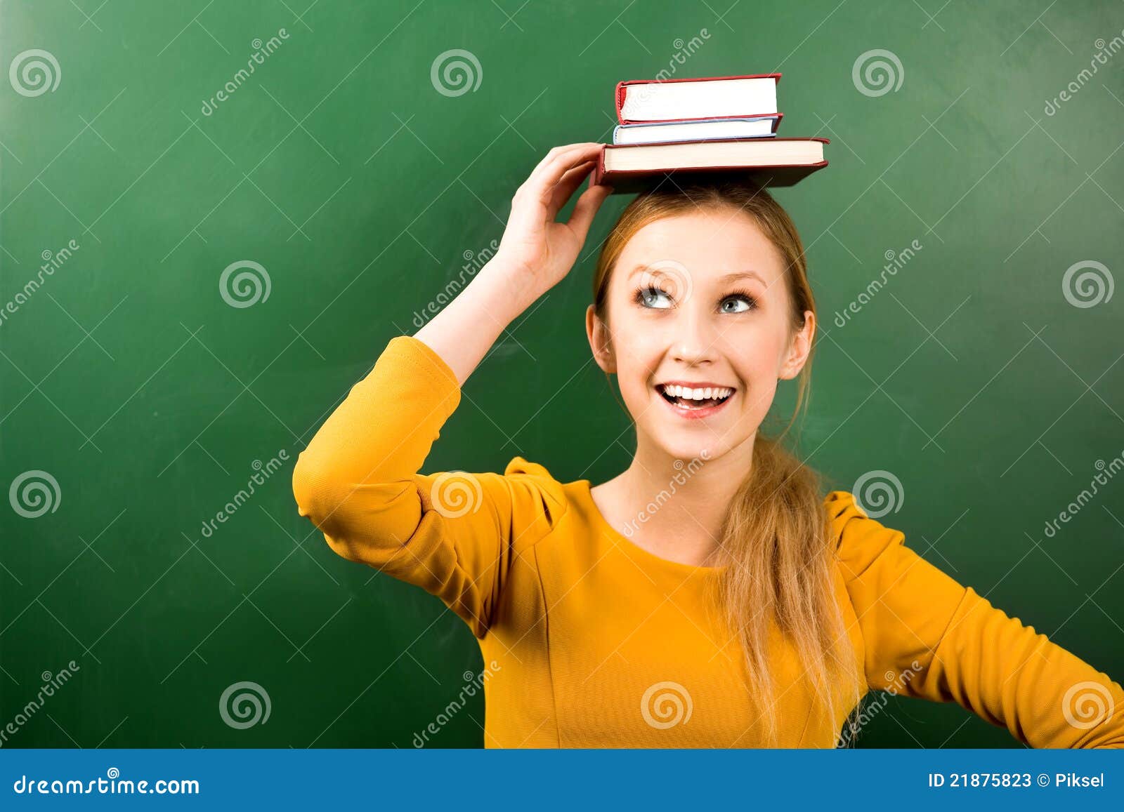 woman balancing books on head