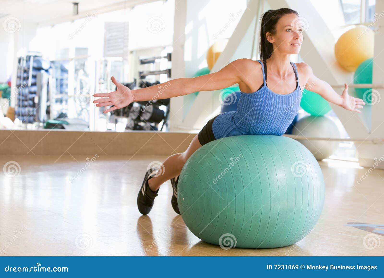 Slim Fit Black Woman Sitting on Yoga Swiss Ball Doing Abs Exercise