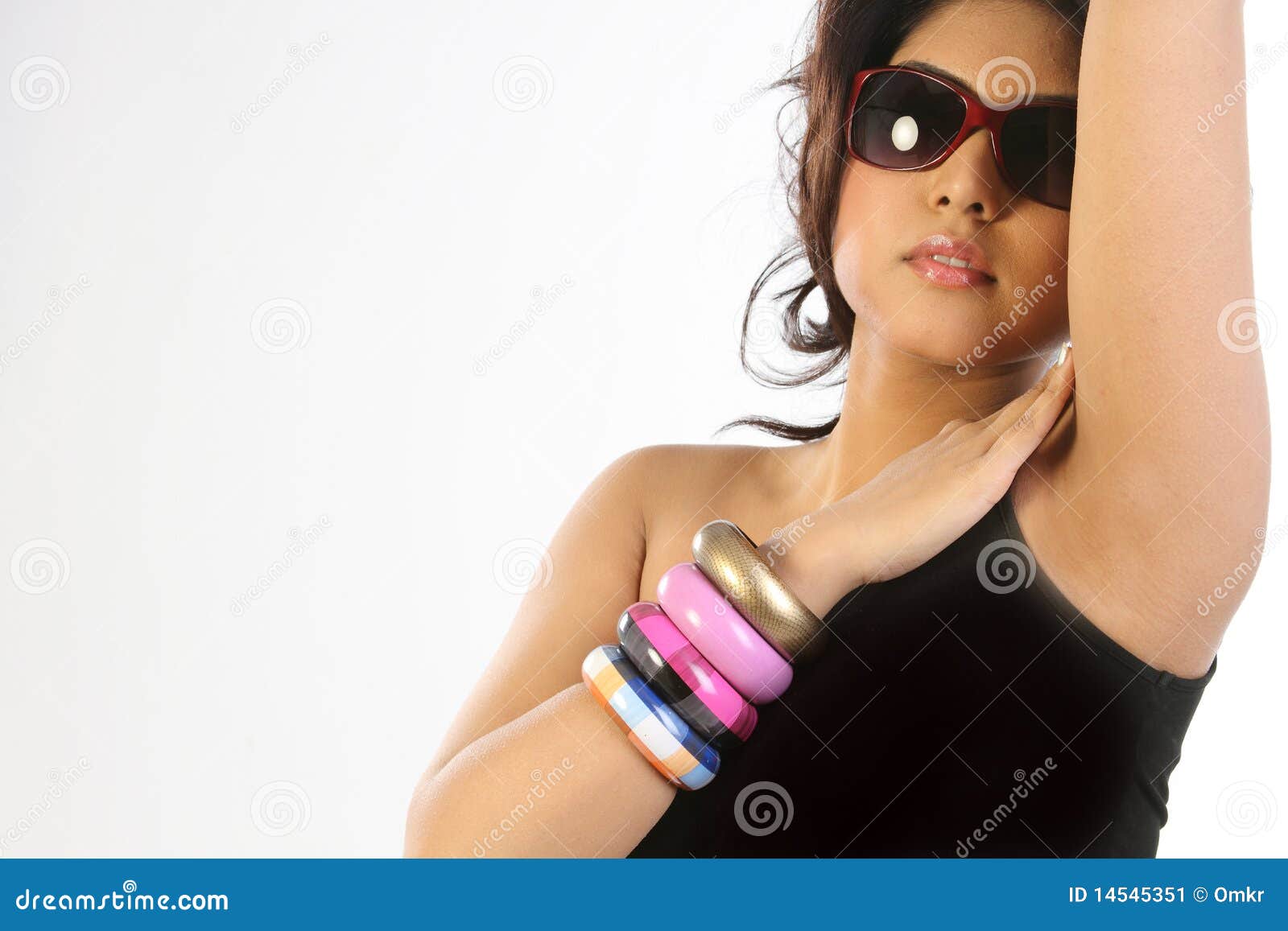 Woman with bangles and sun glasses. Closeup of woman with beautiful bangles and sun glasses