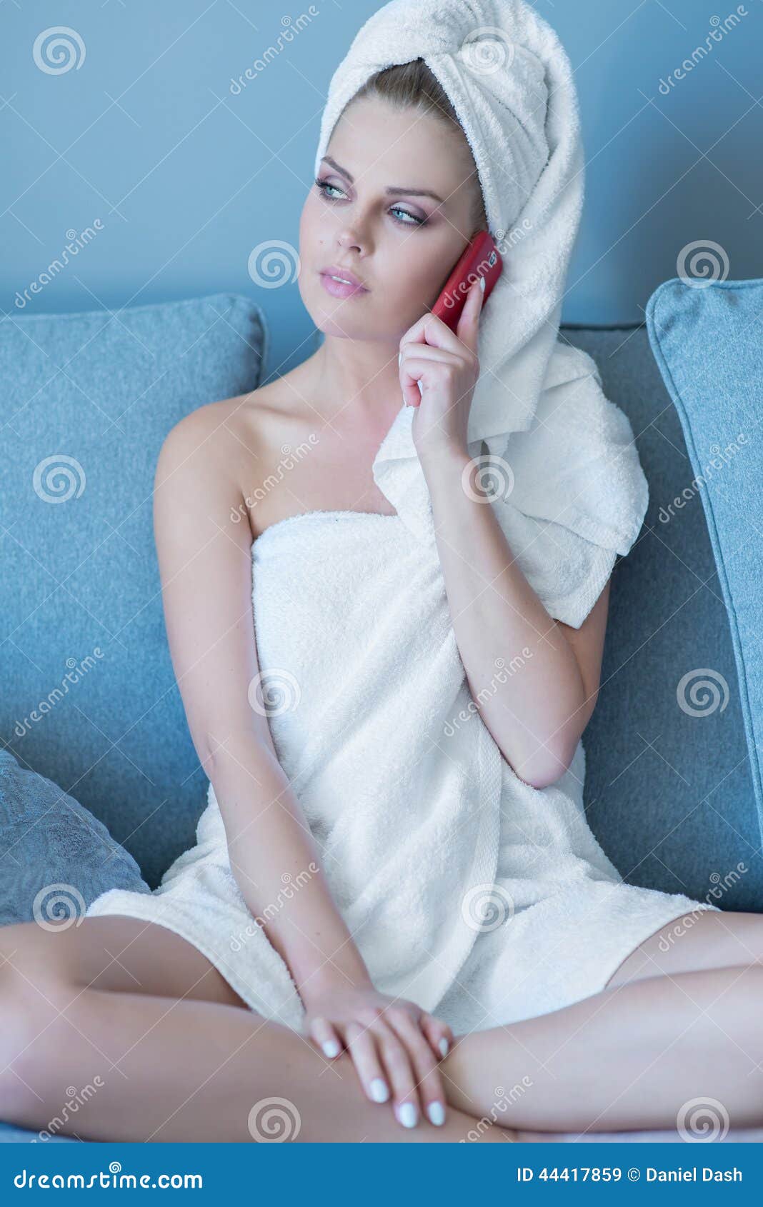 Woman In Bath Towel Talking On Cell Phone Stock Image