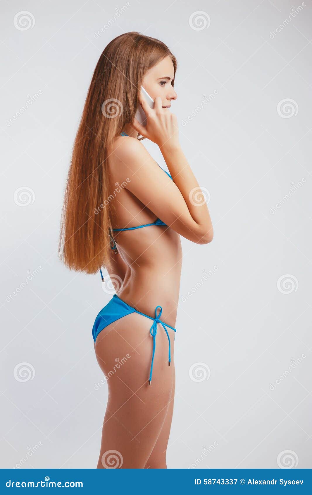 Woman in a Bathing Suit Talking Phone Stock Image image
