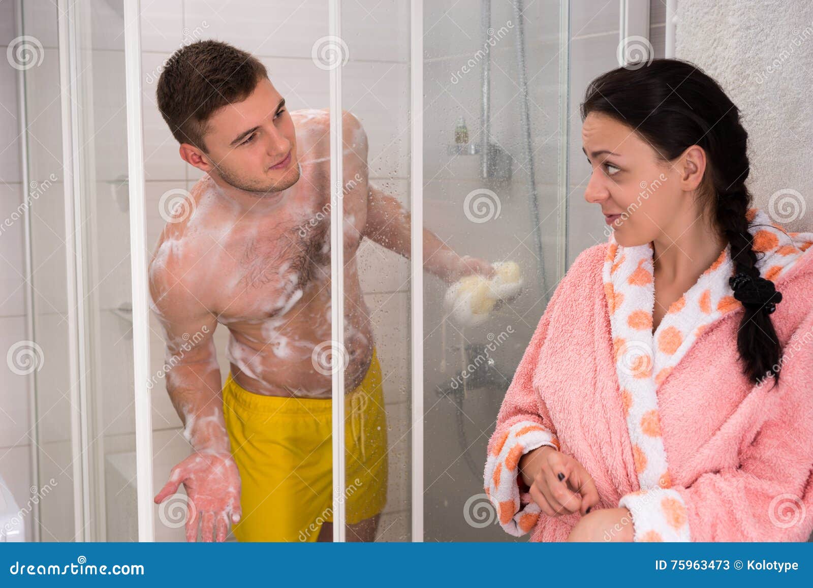 Woman In Bathrobe Points To Husband That It`s Her Turn To Have A Stock Image Image Of Bathroom