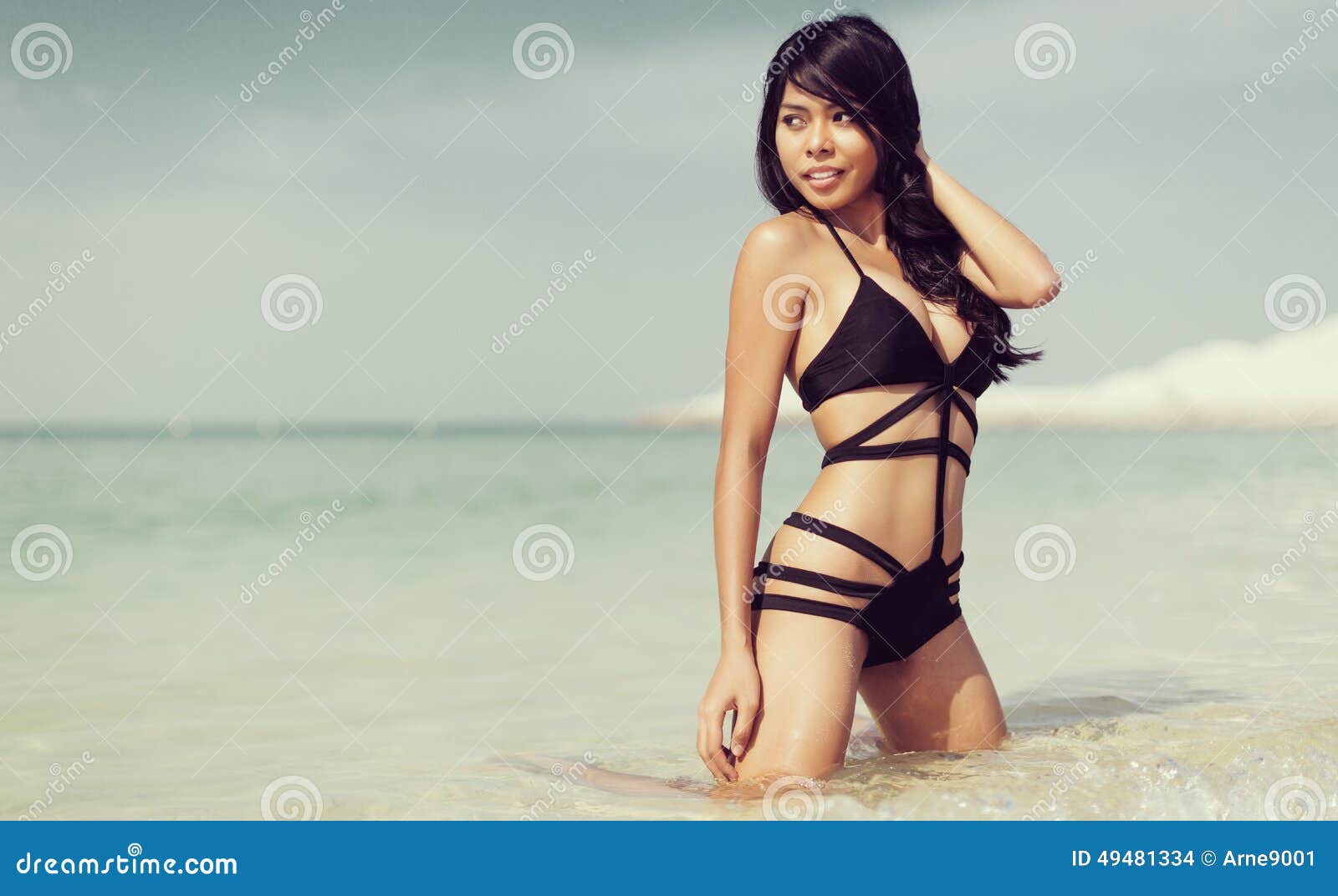 Woman on Beach in Dubai UAE with Swimwear Stock Photo picture