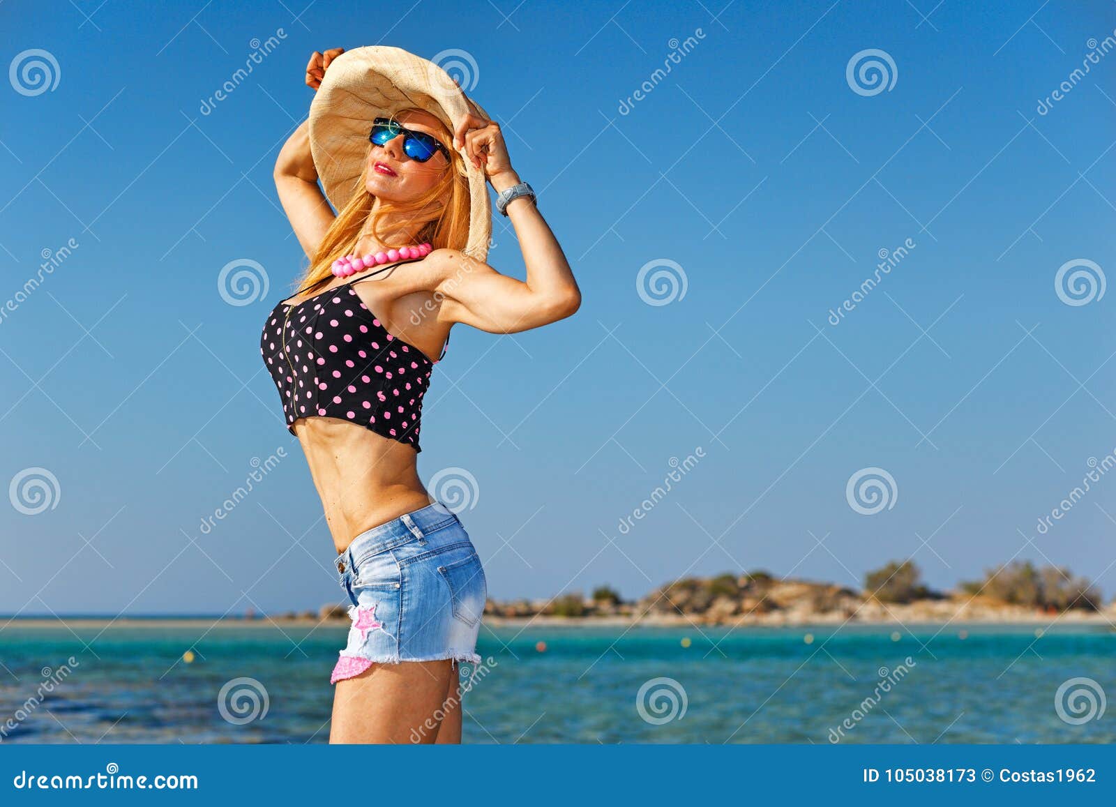 a woman at the beach elafonisos of creta, greece