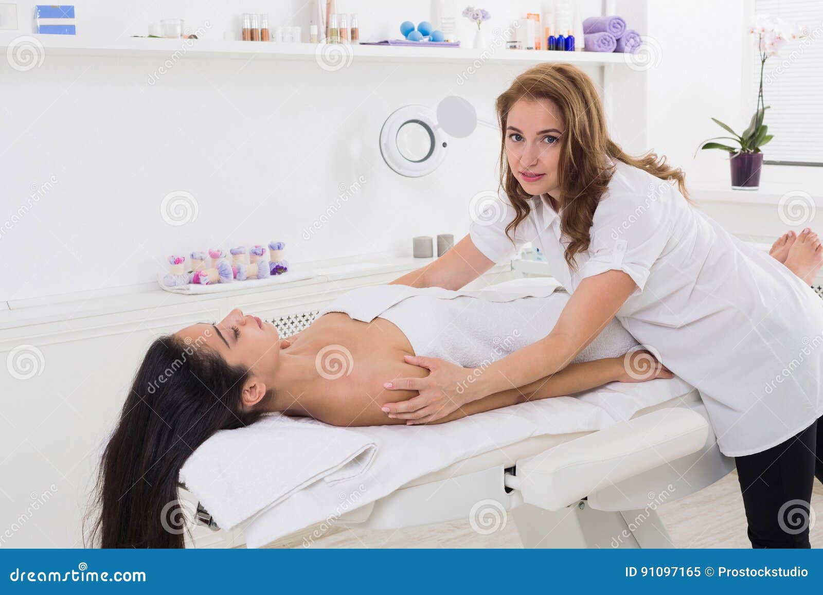 Woman Beautician Doctor Make Head Massage In Spa Wellness Center Stock